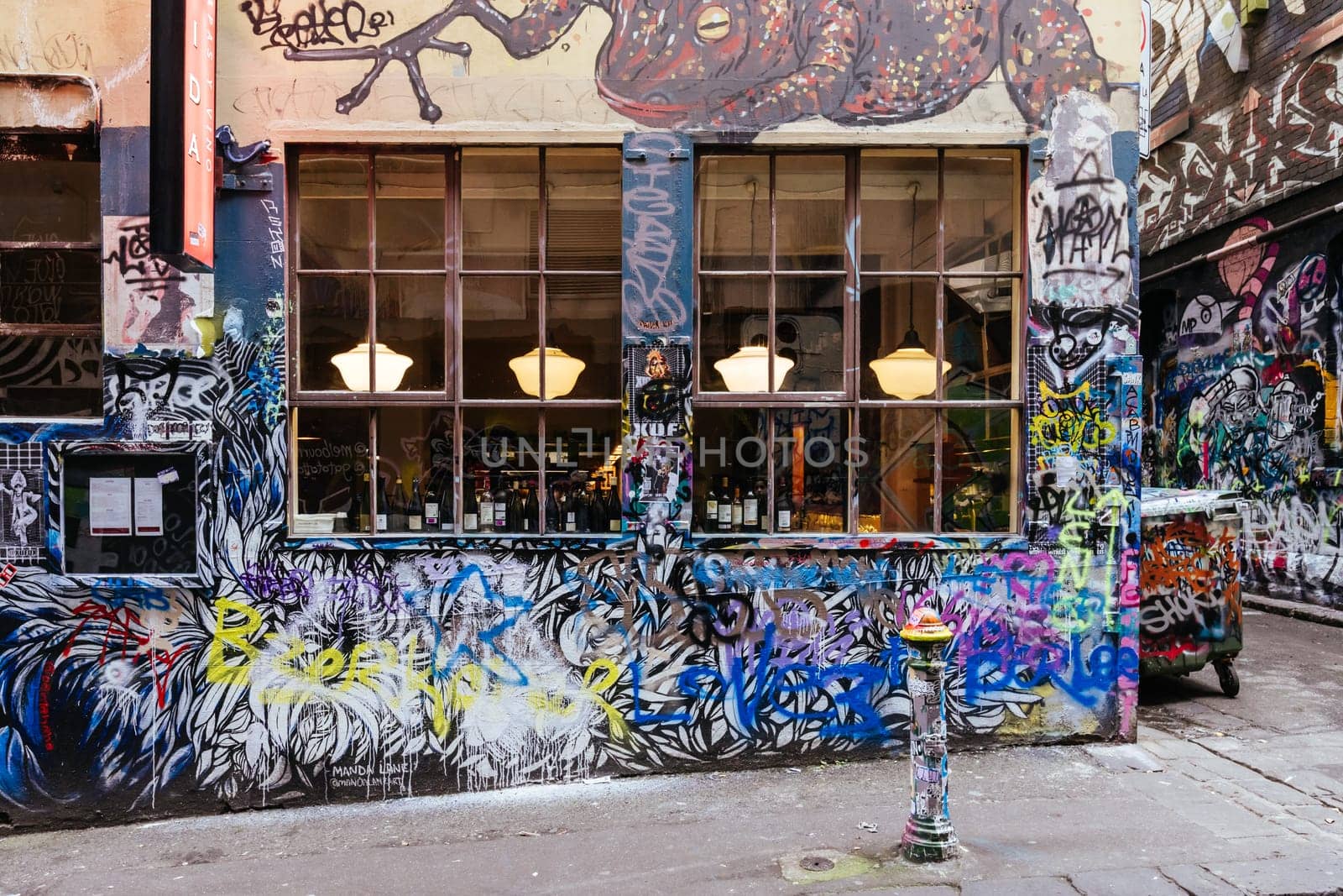 MELBOURNE, AUSTRALIA - June 25 2023: Melbourne's famous Hosier Lane featuring graffiti artwork and grunge urban feel