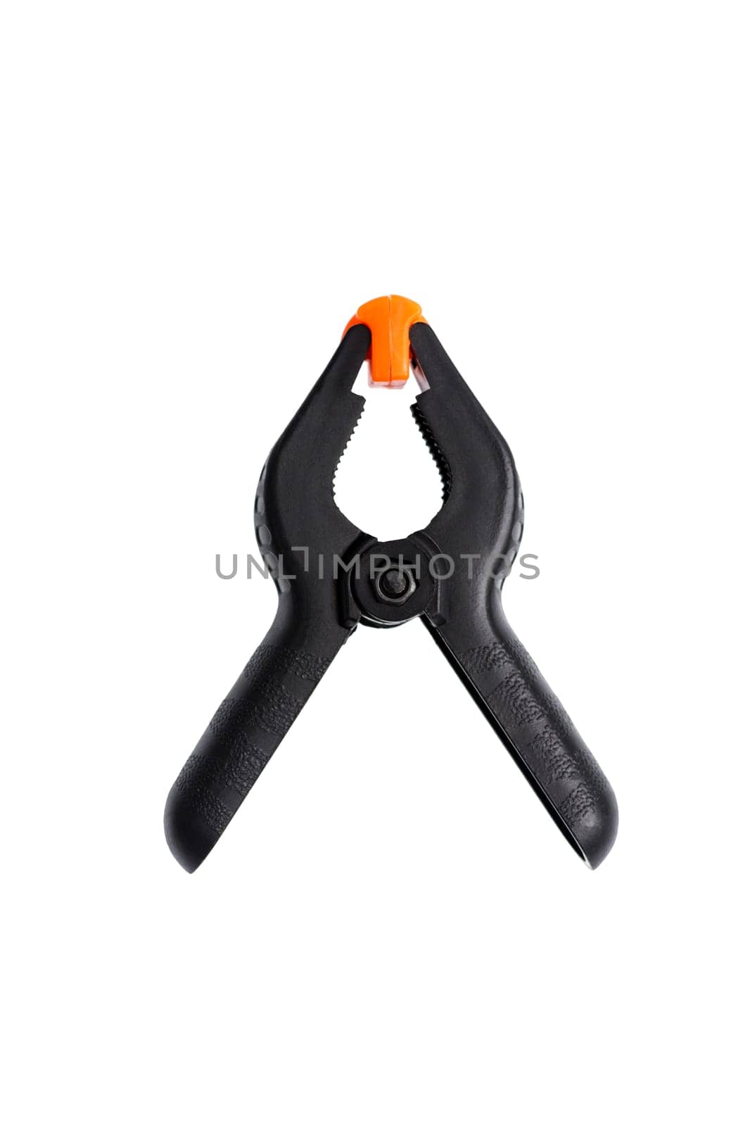 Black plastic clamp isolated on white background. Clamping equipment for handicraft, joinery and photography. Top view.