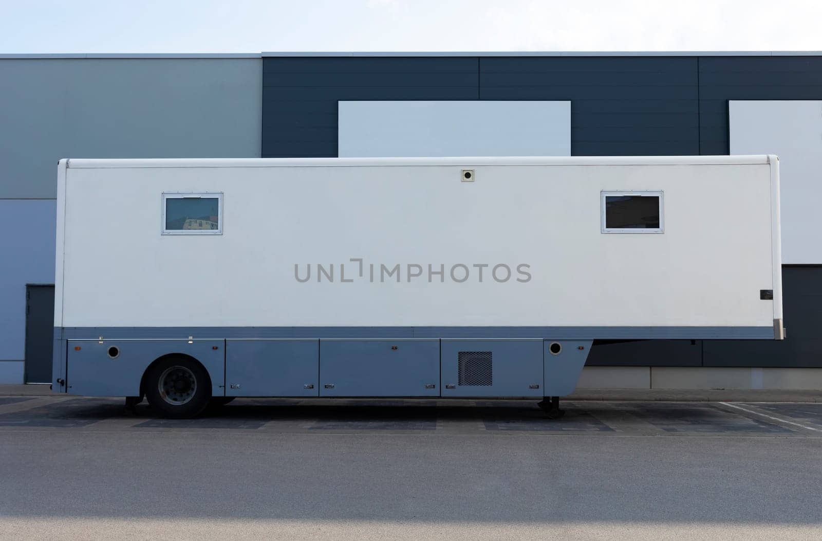 Mobile Outpatient Clinic, Supporting Respiratory Service. White Truck, Bus On Parking Near Store. X-ray, Ultrasound, Health Checkup And Dentistry. Horizontal Plane. Medical Exam. High Quality Photo