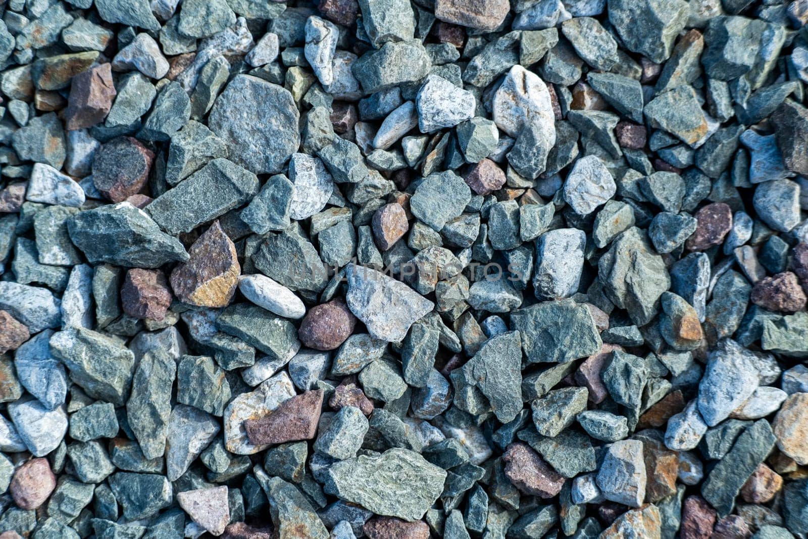 Gravel texture or gravel background. Small road stone background, dark gravel pebbles stone texture seamless texture by TEERASAK