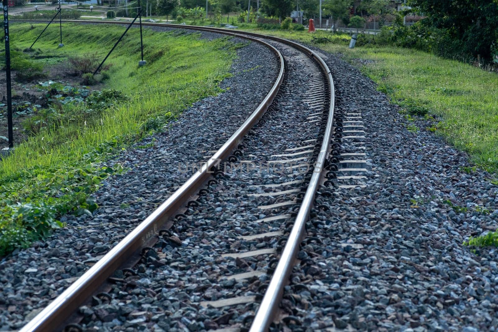 Train tracks in rural scene. Railroad in the park. vintage railroad close up.