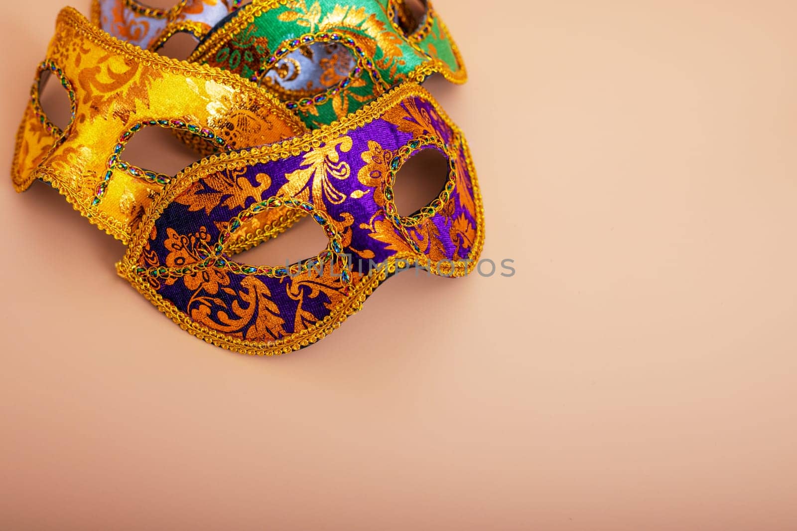 Carnival masks on color background. Purim celebration concept by andreyz
