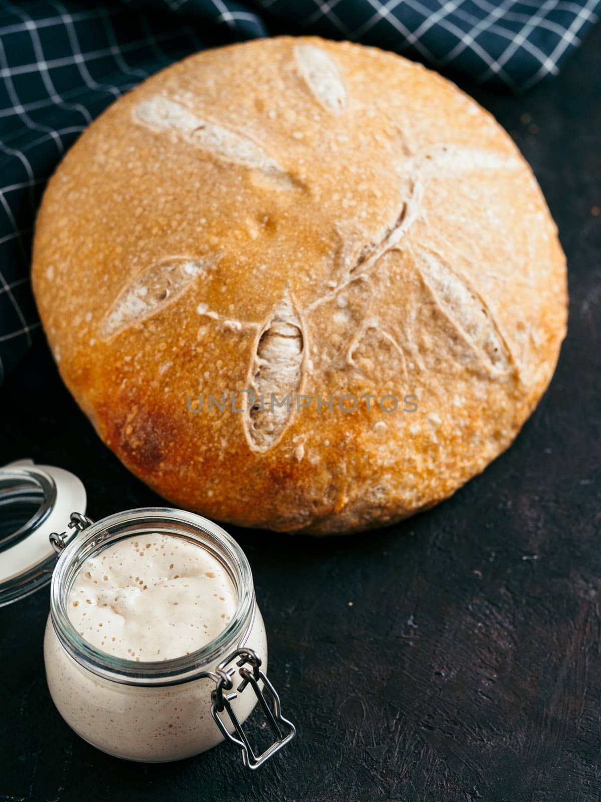 Wheat round sourdough bread, copy space, vertical by fascinadora