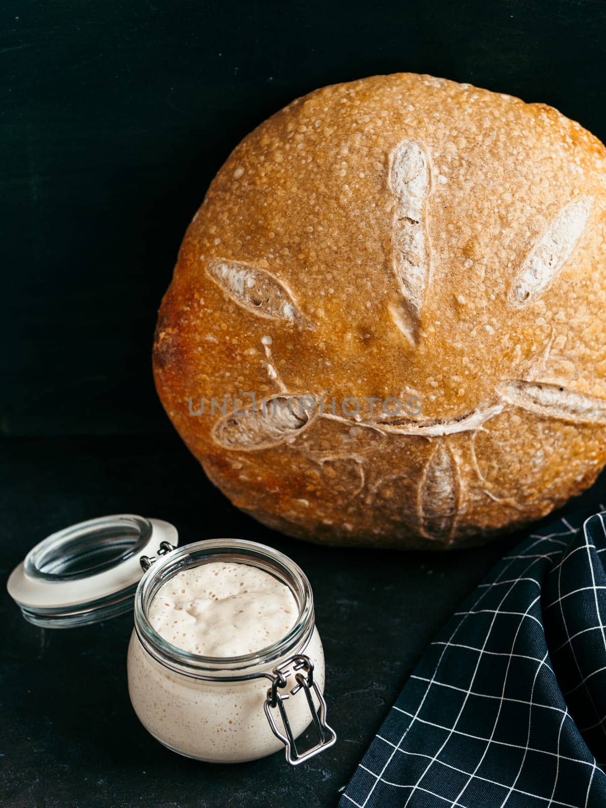 Wheat round sourdough bread, copy space, vertical by fascinadora