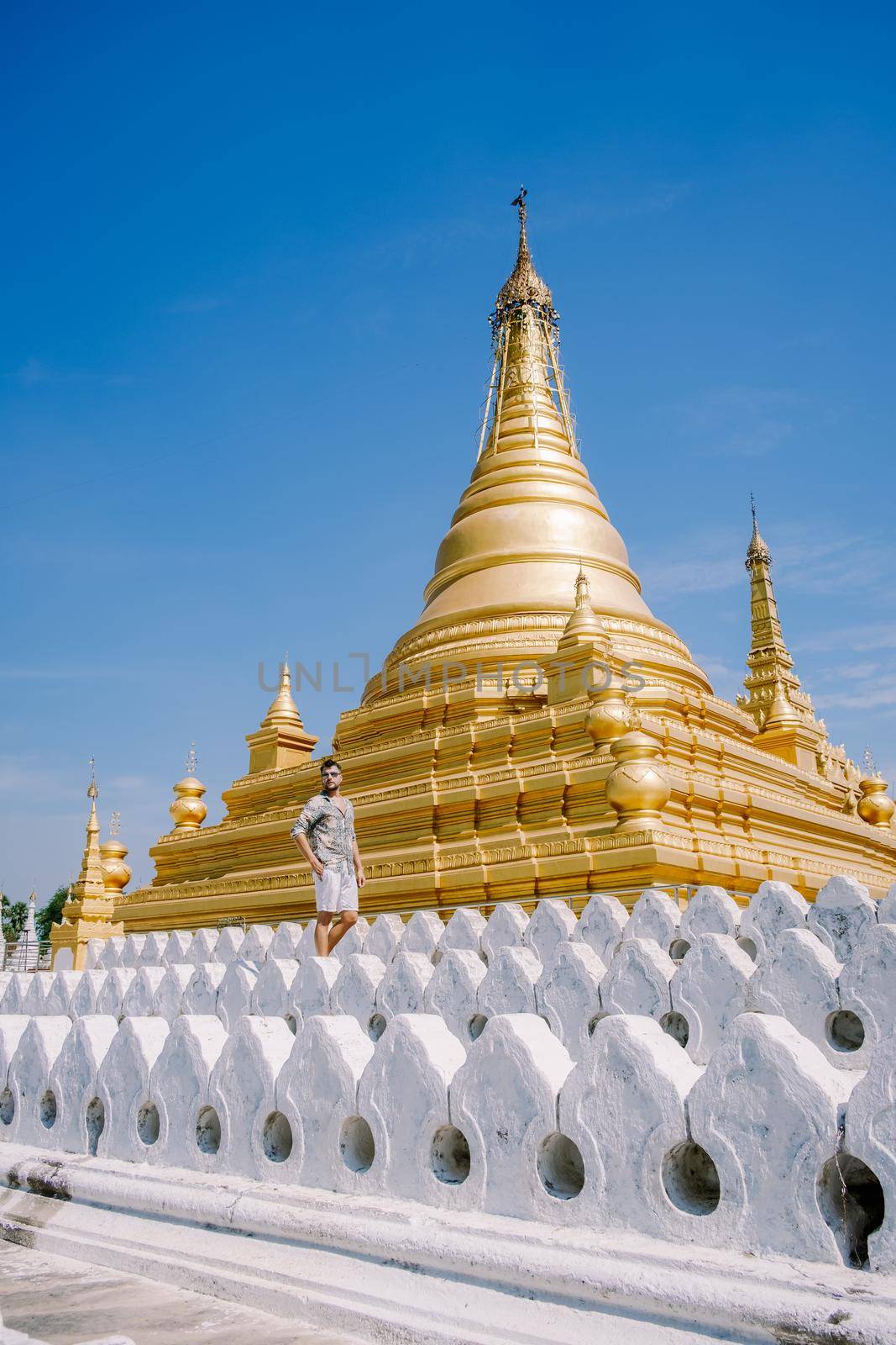 Kuthodaw temple at Mandalay city of Myanmar Burma. people visit temple