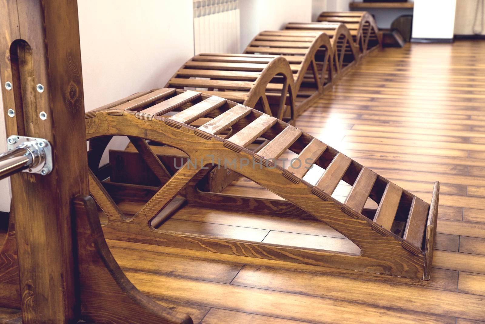 Interior of Gym with yoga wooden benches by Mariakray