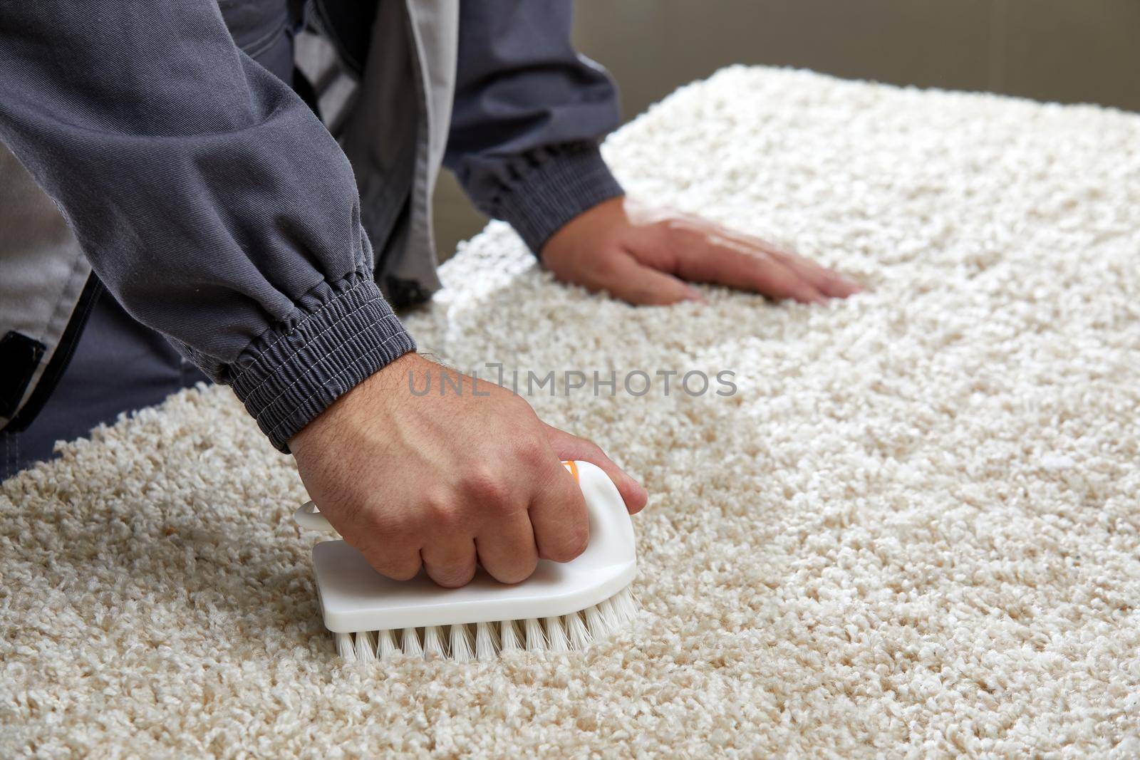 Man holding brush Removing Stain in professional cleaning service . High quality photo