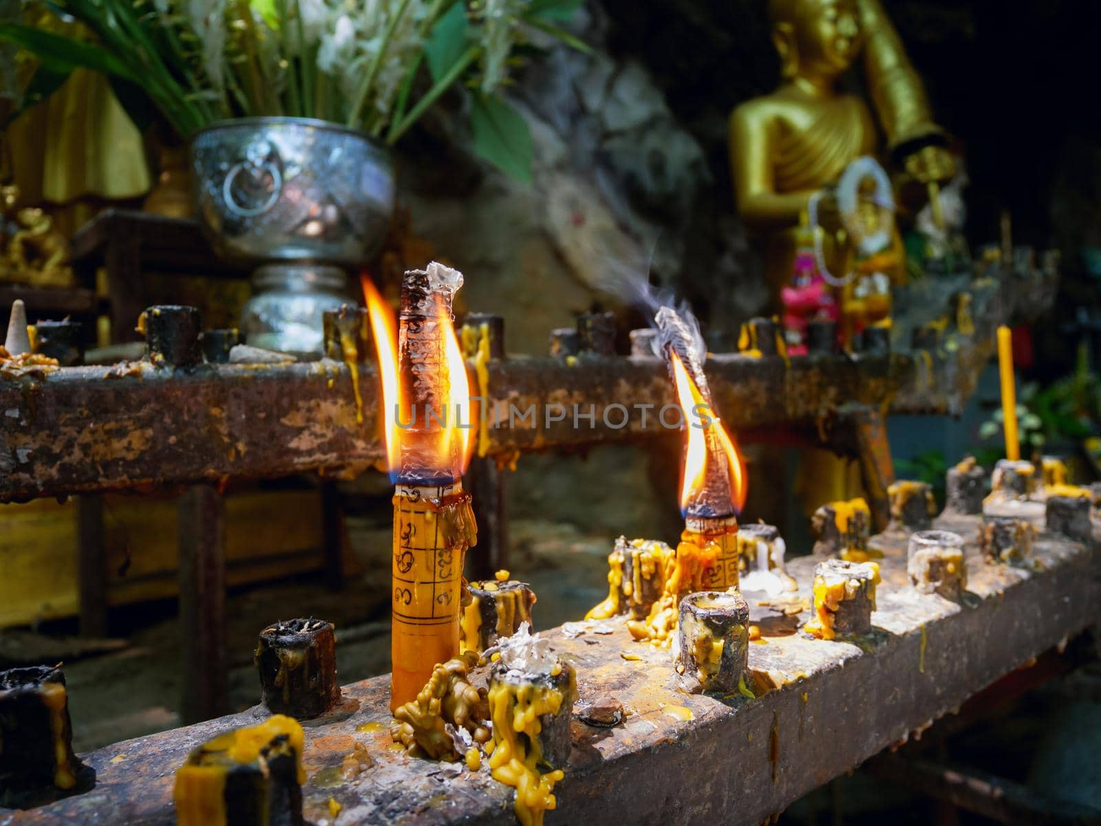 candles flames glowing at the temple