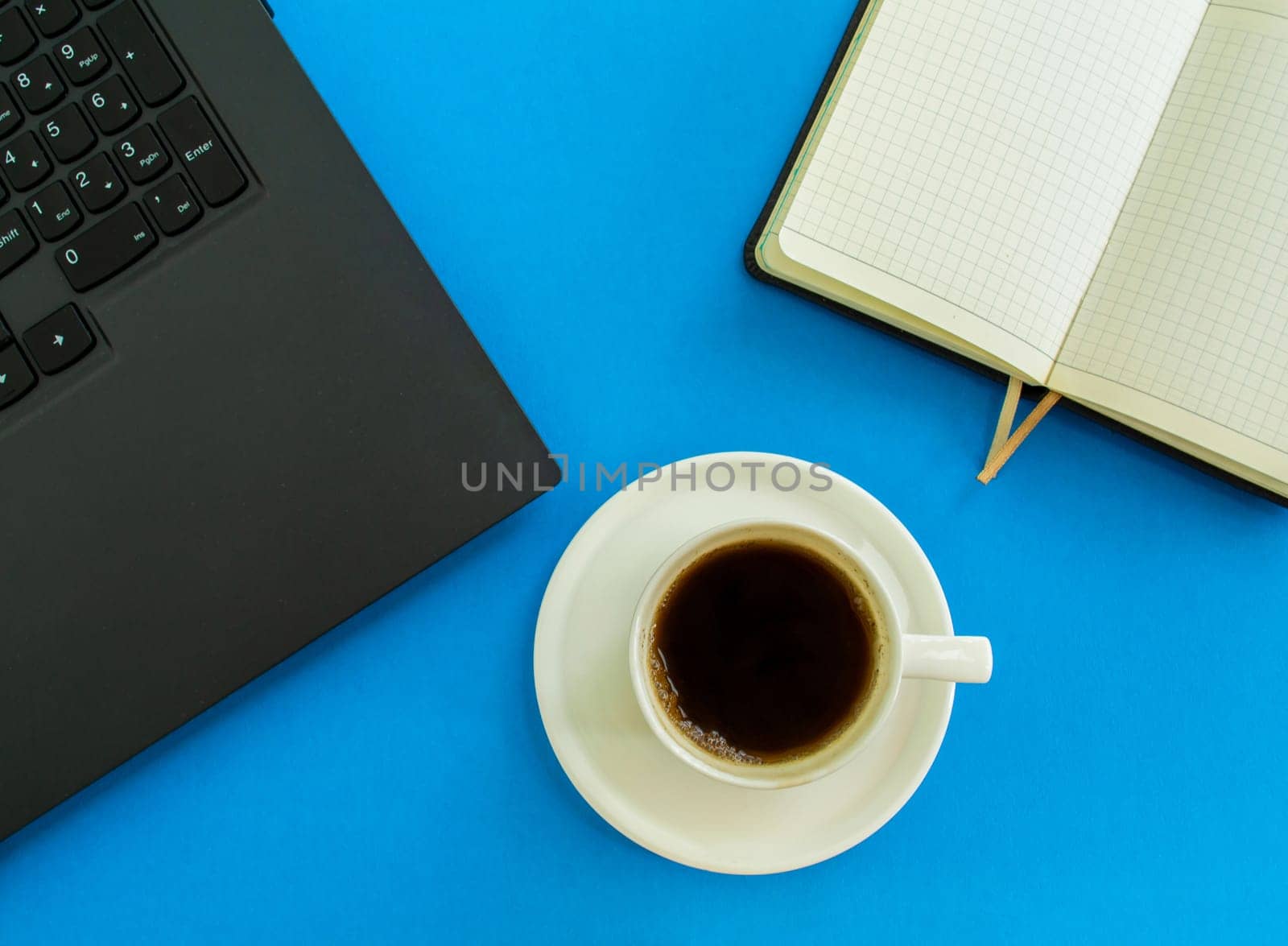 Desktop. Laptop, notepad, coffee cup.  by Yuka777