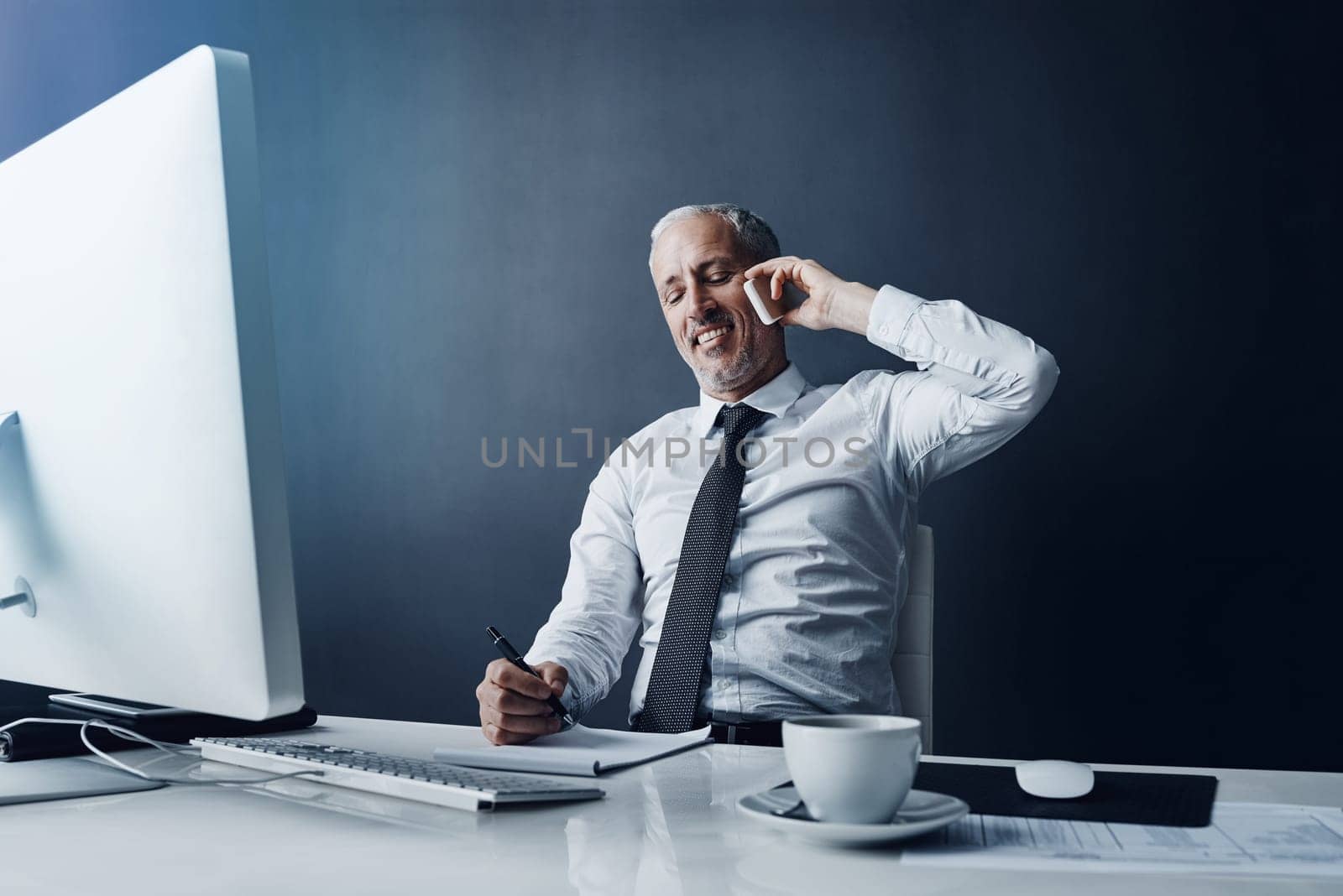 Phone call, writing notes and business man at desk for conversation, communication and talking. Networking, communication and happy mature male person on smartphone for discussion, chat and planning.