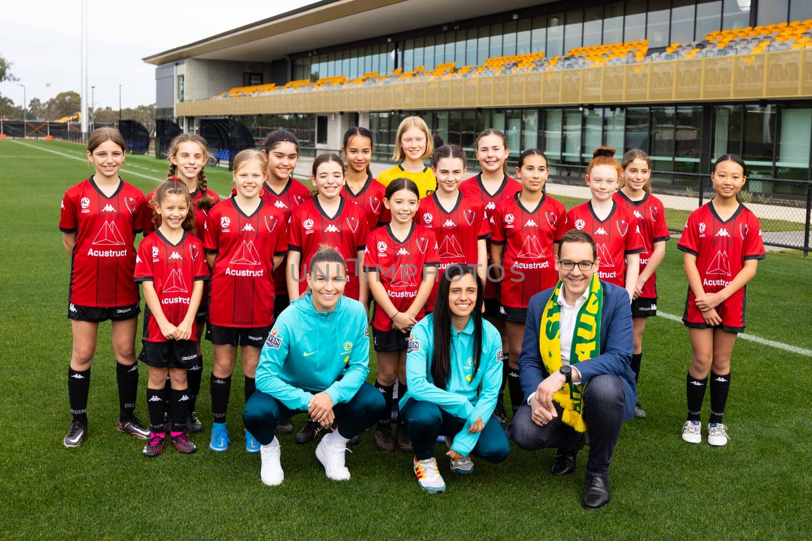 MELBOURNE, AUSTRALIA - JULY 03: Matildas Alex Chidiac, Steph Catley with Sports Minister Steve Dimopoulous and children from Eltham Redbacks FC at the official opening of the Australian Matildas training facility and FIFA 2023 Women's World Cup squad announcement at La Trobe University on July 03, 2023 in Melbourne, Australia.