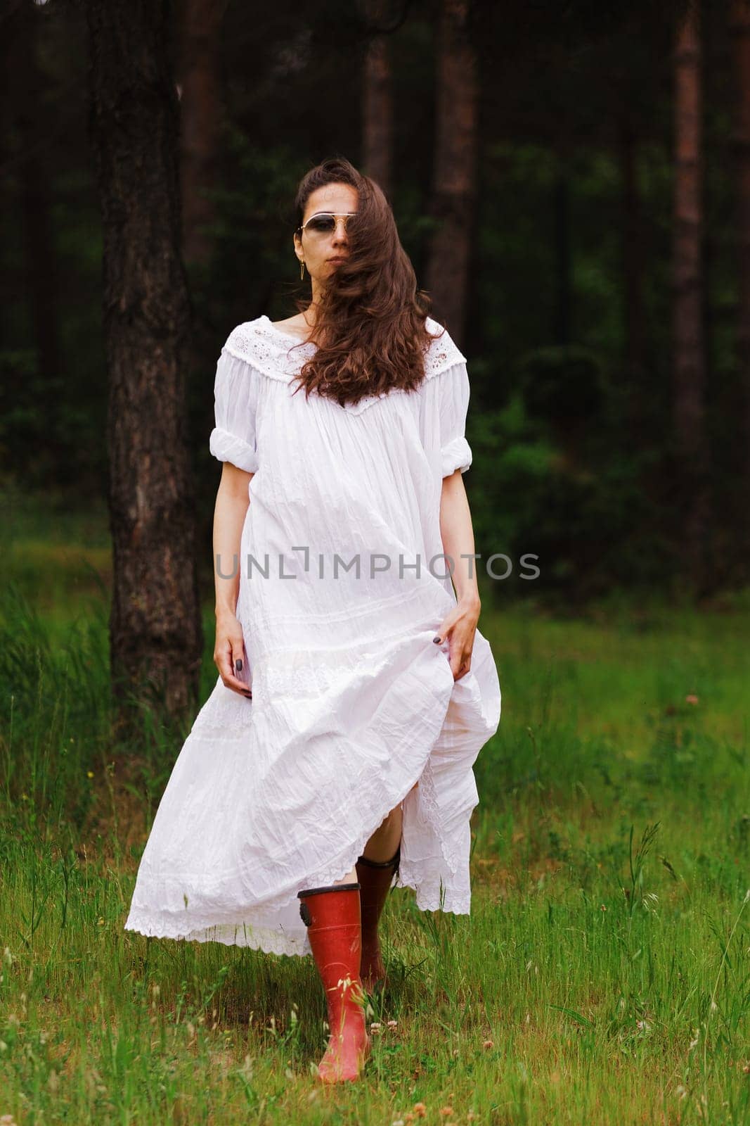 Portrait of beautiful woman in white dress.