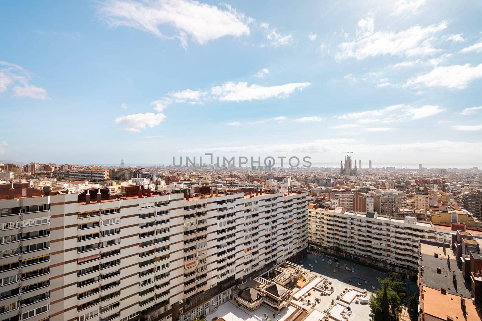 A captivating Barcelona cityscape showcases stunning architecture against a clear sky, creating a vibrant urban scene.