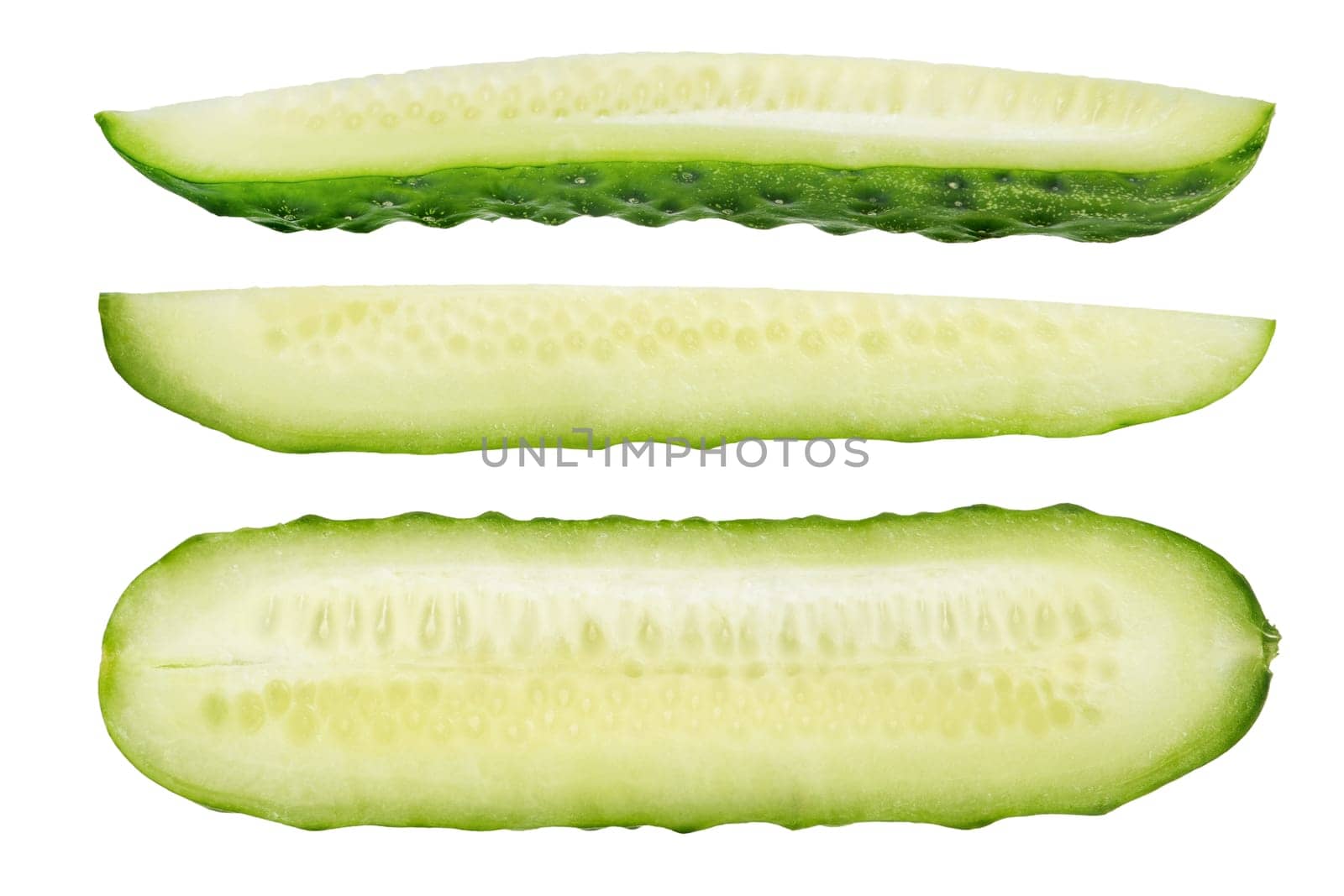 Long slices of green cucumbers on a white isolated background. Cucumber slices on white. The concept of a delicious addition to a salad. High quality photo by SERSOL