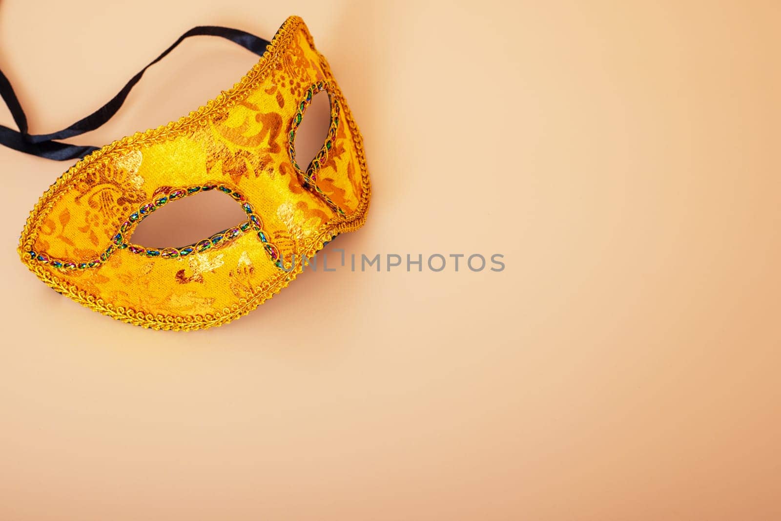 Carnival mask on color background. Purim celebration concept (jewish carnival holiday). Masquerade party or celebration concept.