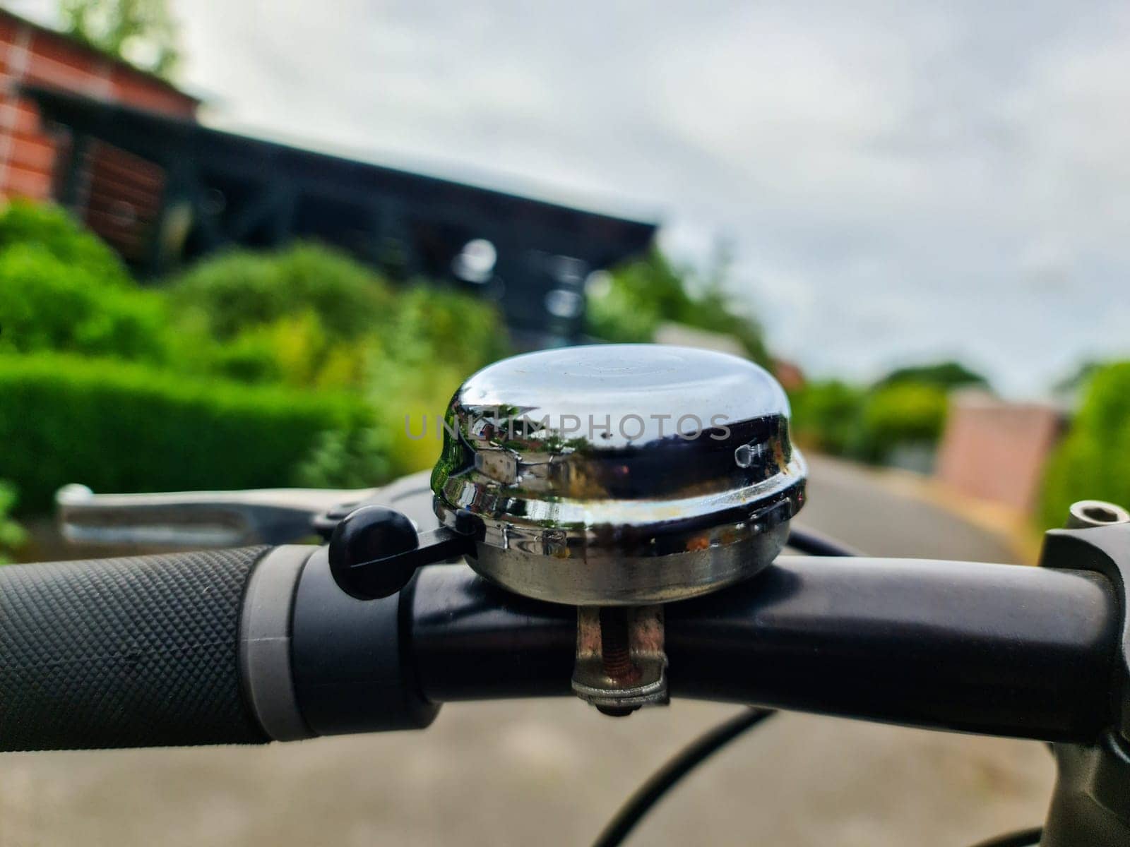 Close-up view of a bicycle bell on a handlebar. by MP_foto71