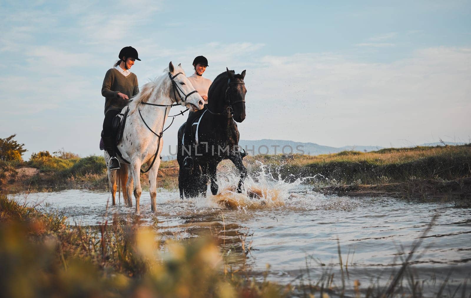 Horse riding, friends and women at lake in countryside with outdoor mockup space. Equestrian, happy girls and animals in water, nature and adventure, travel and journey for summer vacation together