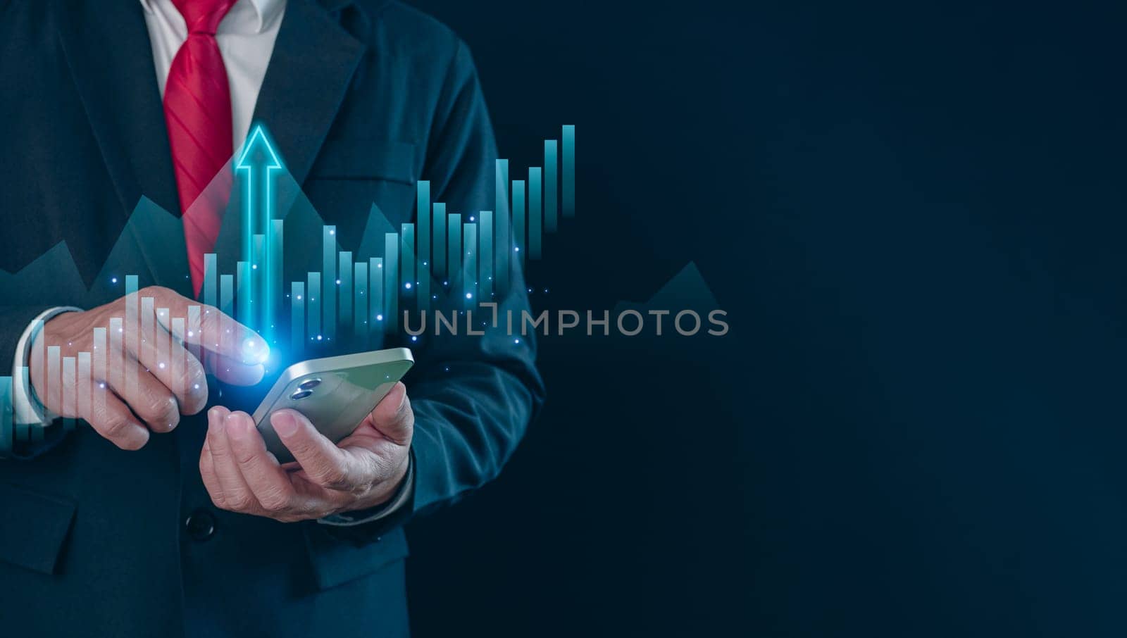 Hologram image of a candlestick chart from a phone on businessman hand. Offer trading, investment ideas