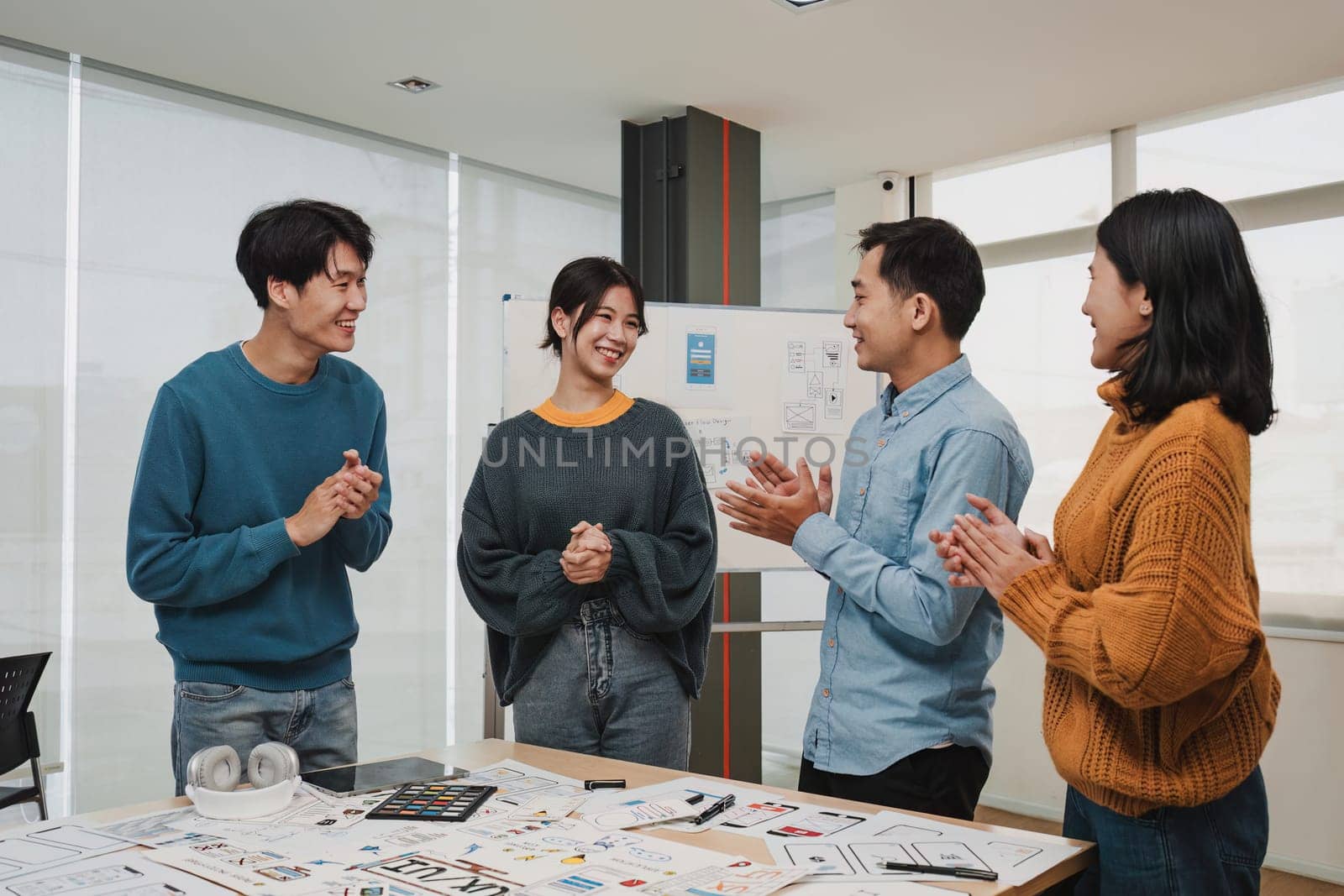 Team of ux developer and ui designer brainstorming interface wireframe design.Creative digital development agency by itchaznong
