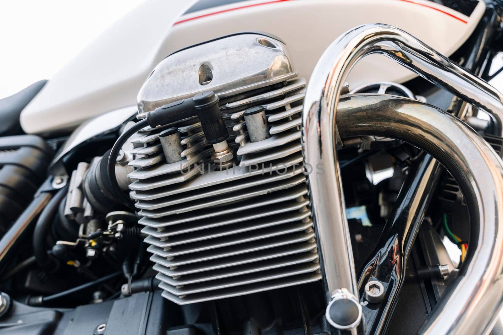 The engine of a classic motorcycle. side view. motor, cylinders, cooling fins