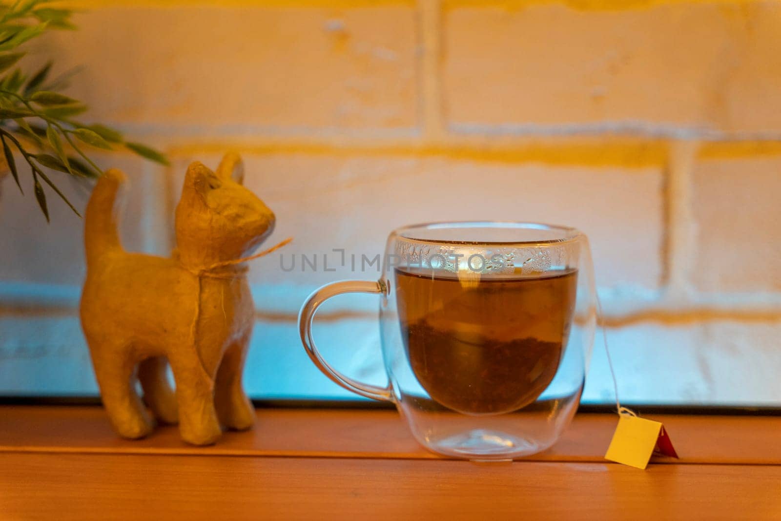 A glass electric kettle on a wooden table and a transparent mug by audiznam2609