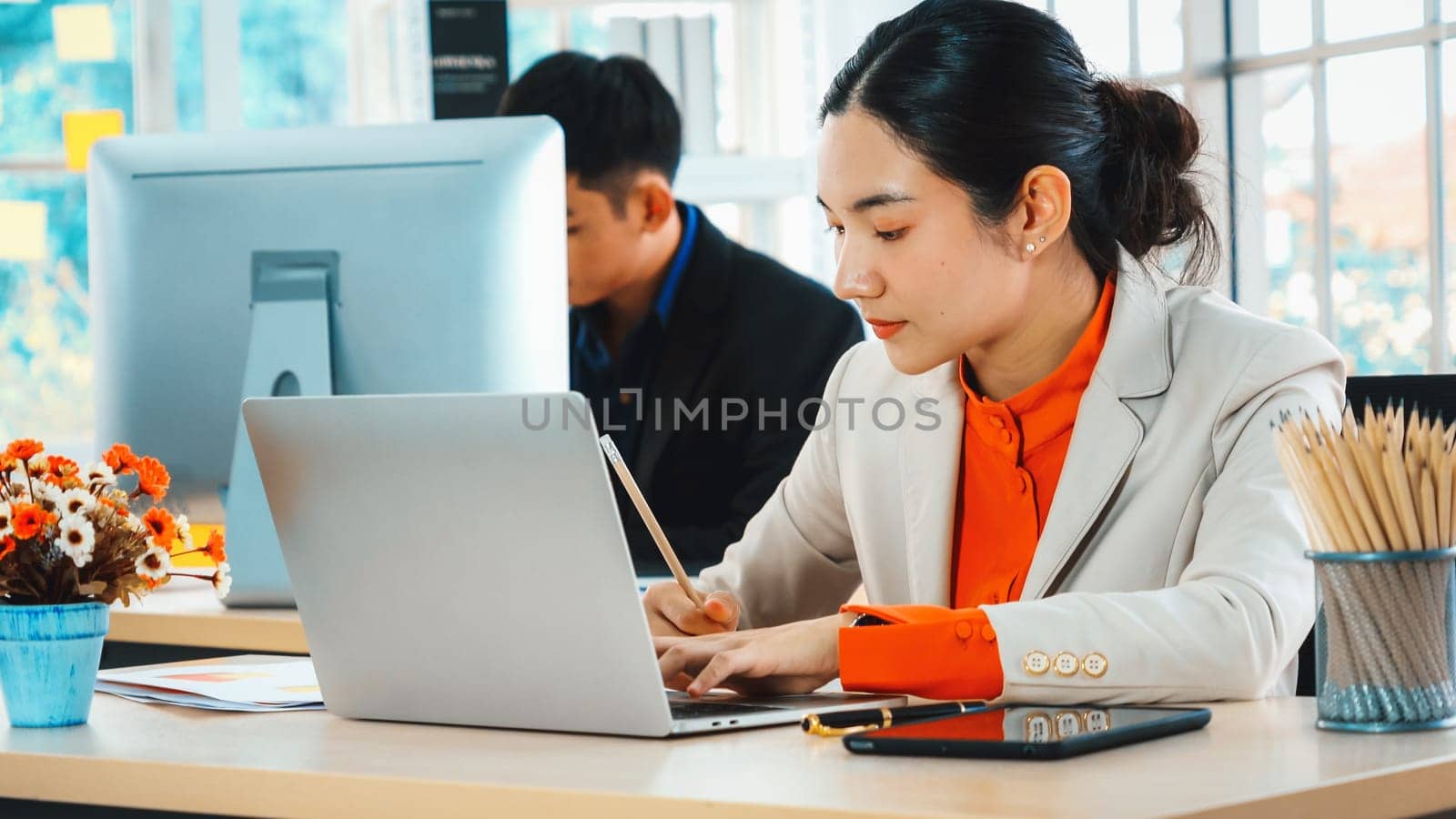 Business people working at table in modern office Jivy by biancoblue