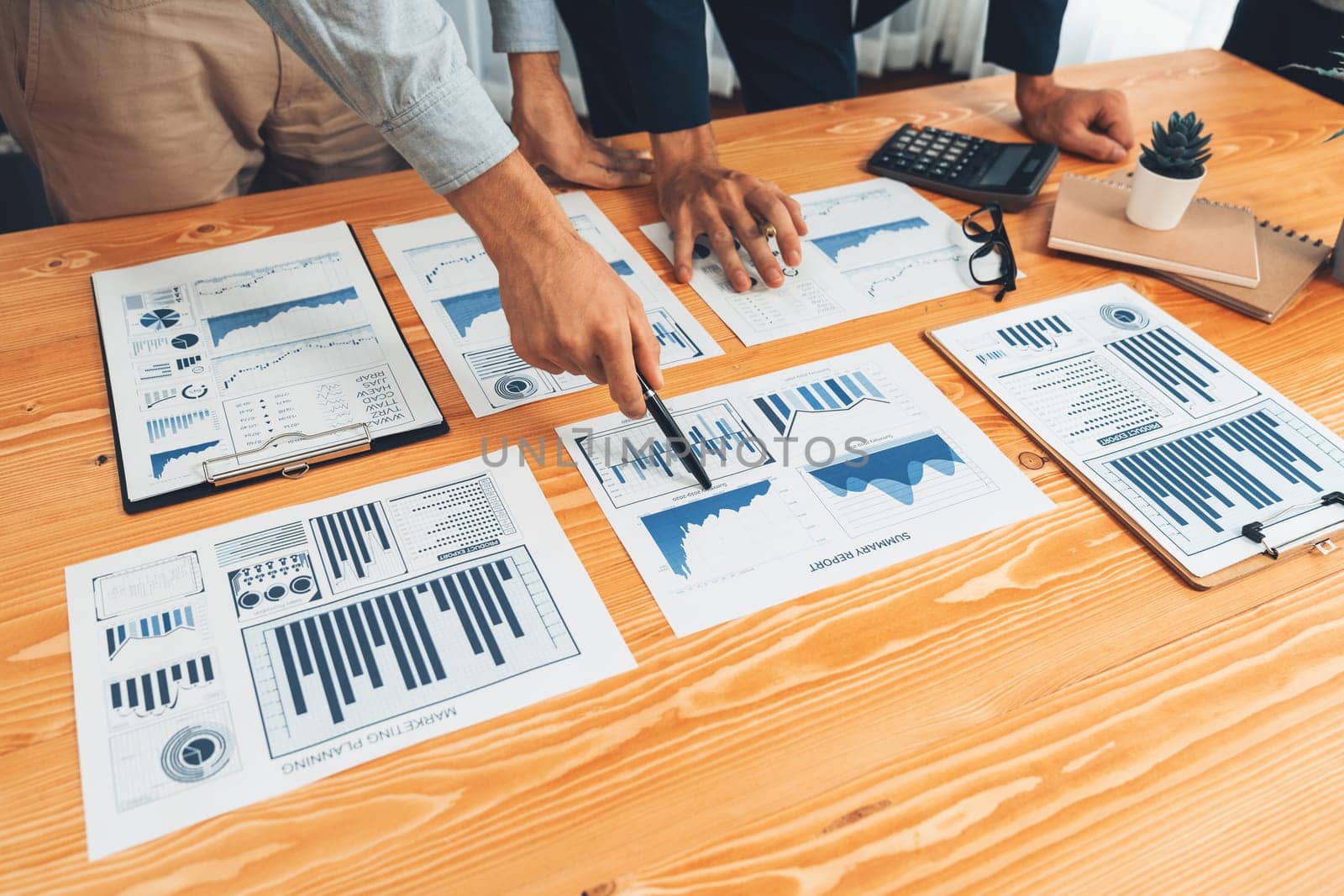 Analyst team in office analyzing financial data analysis for marketing strategy in workspace, pile of BI dashboard paper format with graph and chart to optimize performance and risk management. Entity