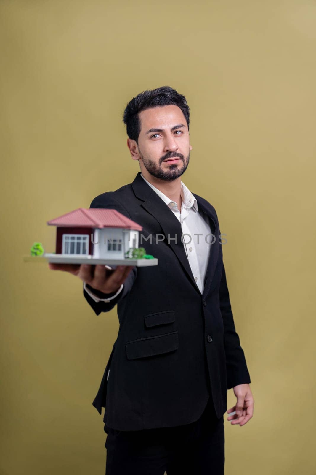 Real estate agent hold house model sample on isolated background. Fervent by biancoblue