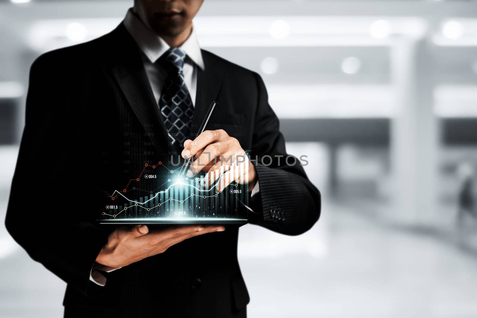 Businessman analyst working with digital finance business data graph showing technology of investment strategy for perceptive financial business decision. Digital economic analysis technology concept.