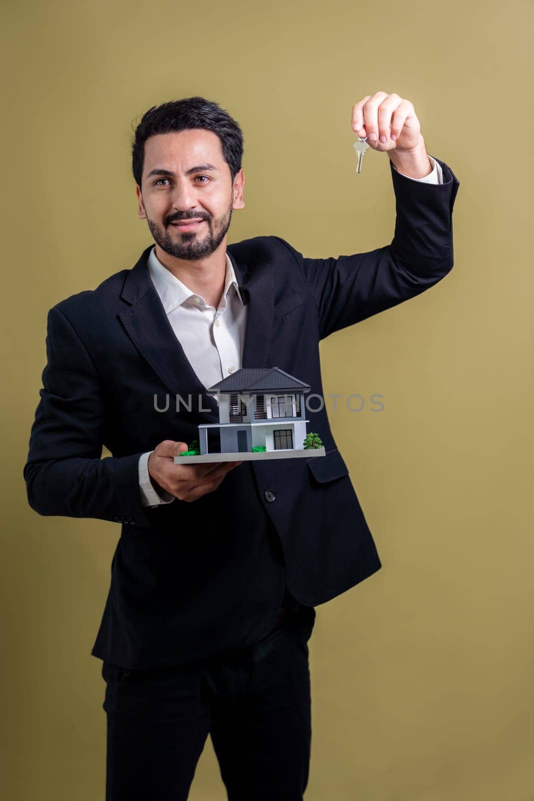 Real estate agent hold house model and key on isolated background. Fervent by biancoblue