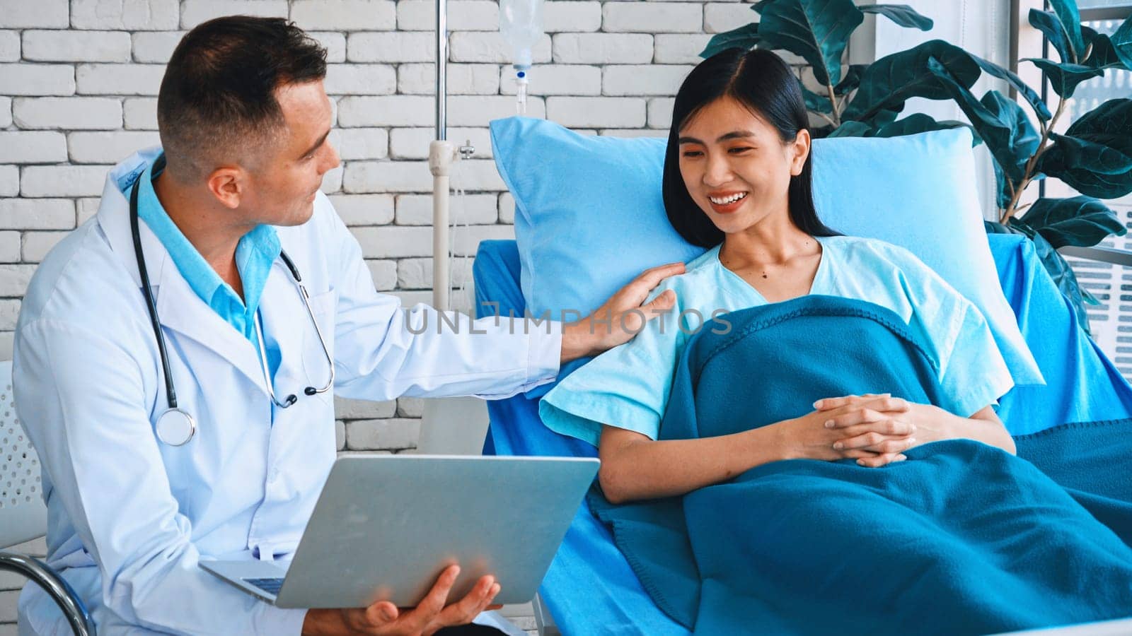 Doctor in professional uniform examining patient at hospital or medical clinic. Health care , medical and doctor staff service concept. Jivy