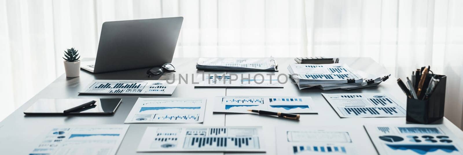 BI data dashboard from Fintech on laptop screen displays comprehensive business analysis in empty office. Technology empowering business financial data visualization and growth strategy. Prodigy