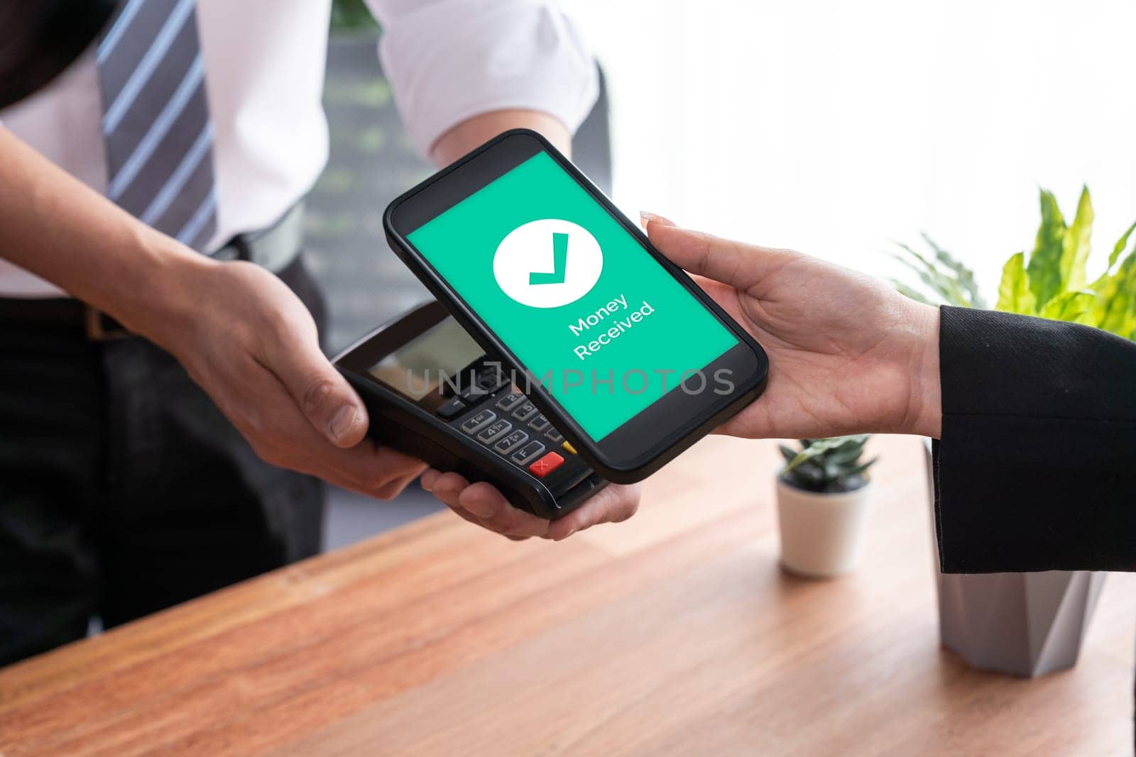 Seamless cashless payments with barcode scanning on smartphone application. Utilizing QR code technology, secure and fast transactions for modern shopping lifestyle with mobile banking app. Jubilant