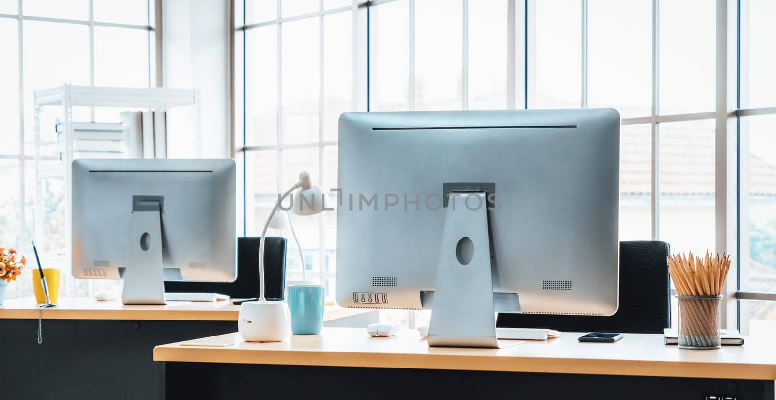 Desktop PC computers in small modern office or home office. Jivy by biancoblue