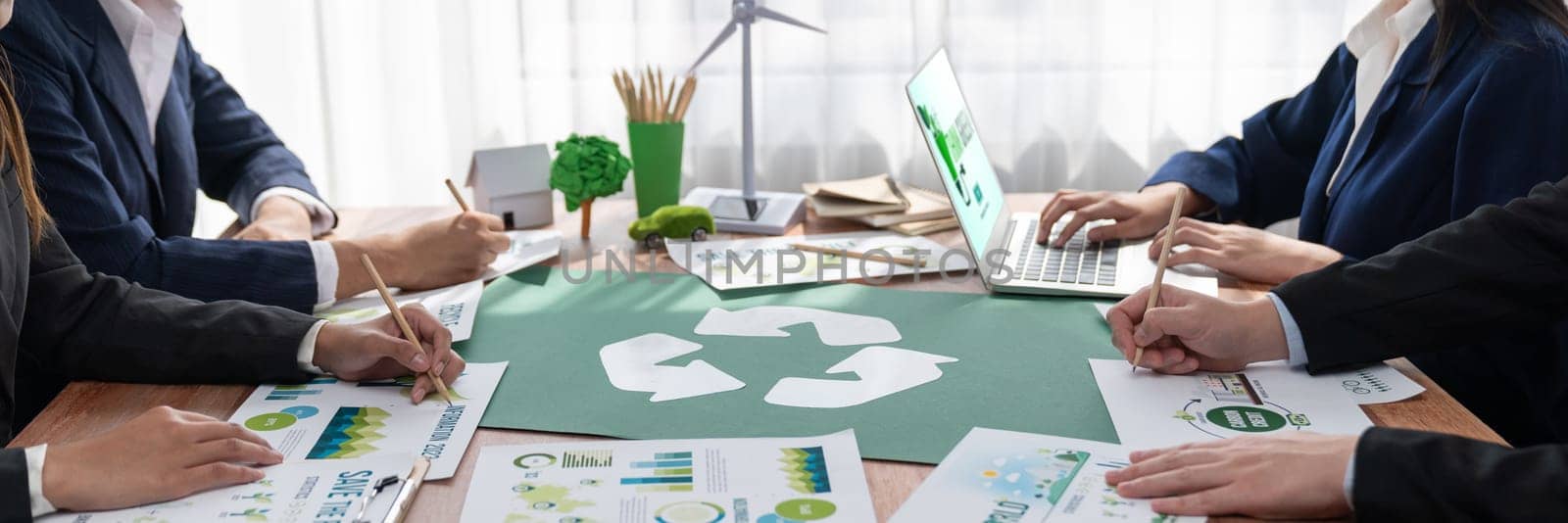 Group of business people planning and discussing on recycle symbol.Trailblazing by biancoblue