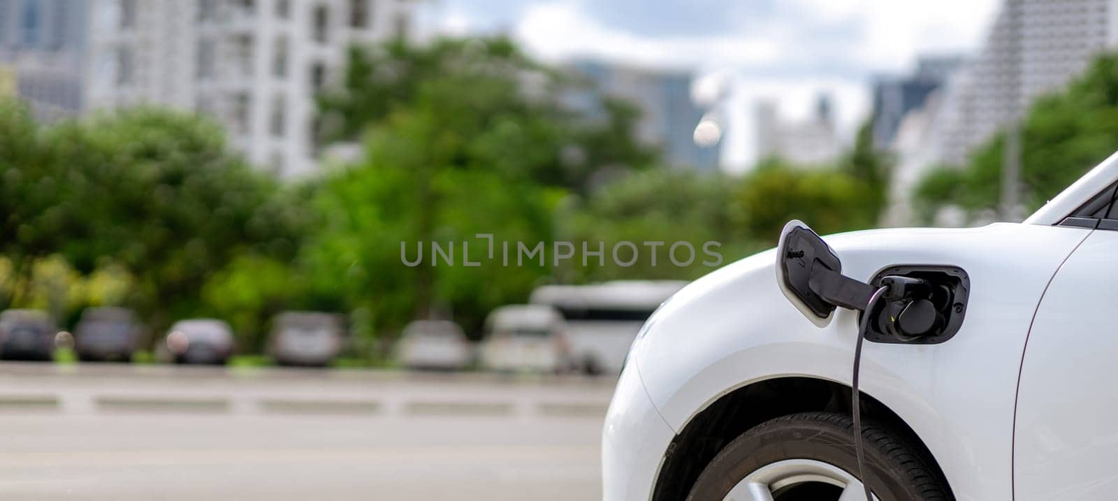 Focus closeup EV car and charger with blur background for progressive concept by biancoblue