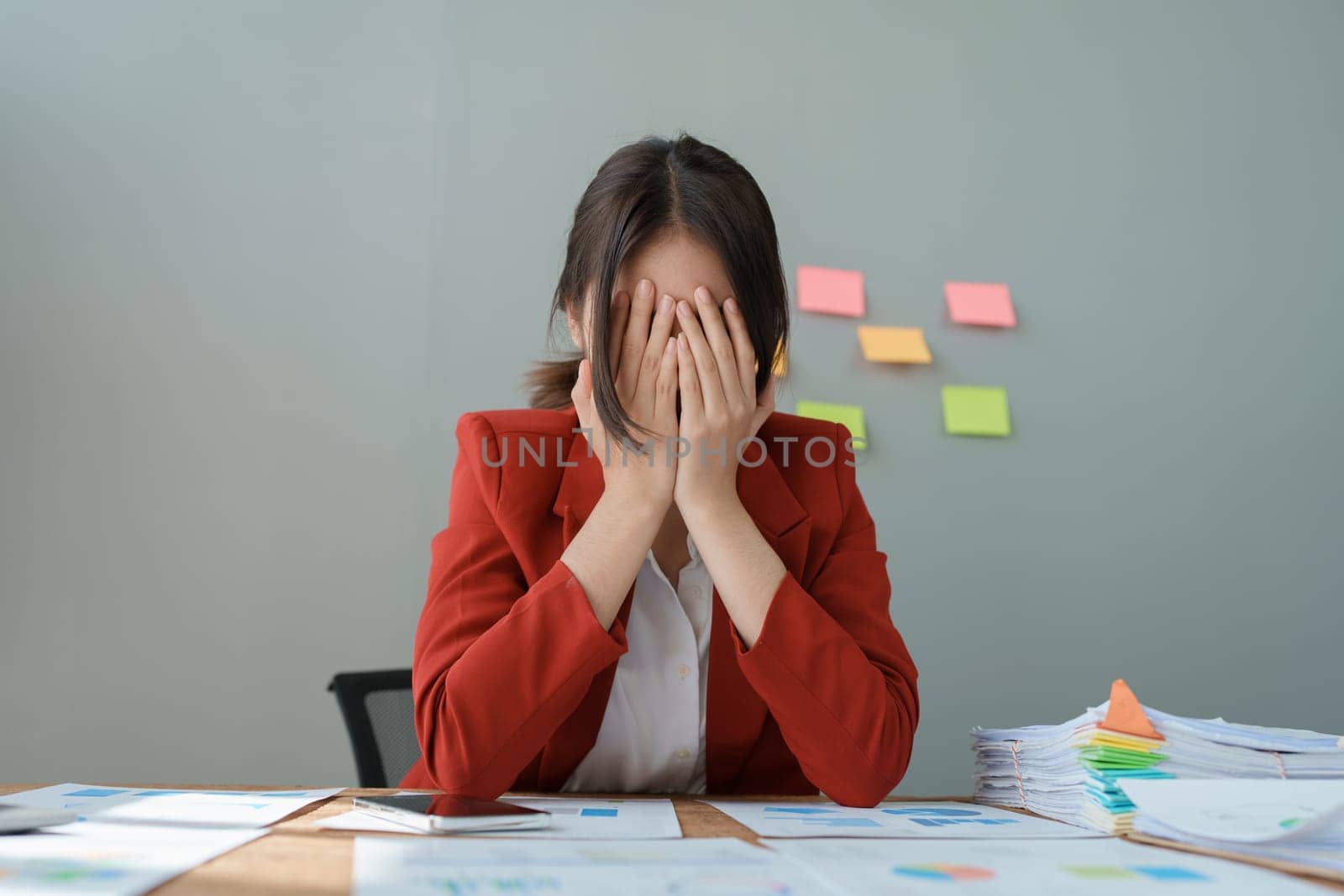 Portrait of business owner, woman using computer and financial statements Anxious expression on expanding the market to increase the ability to invest in business.