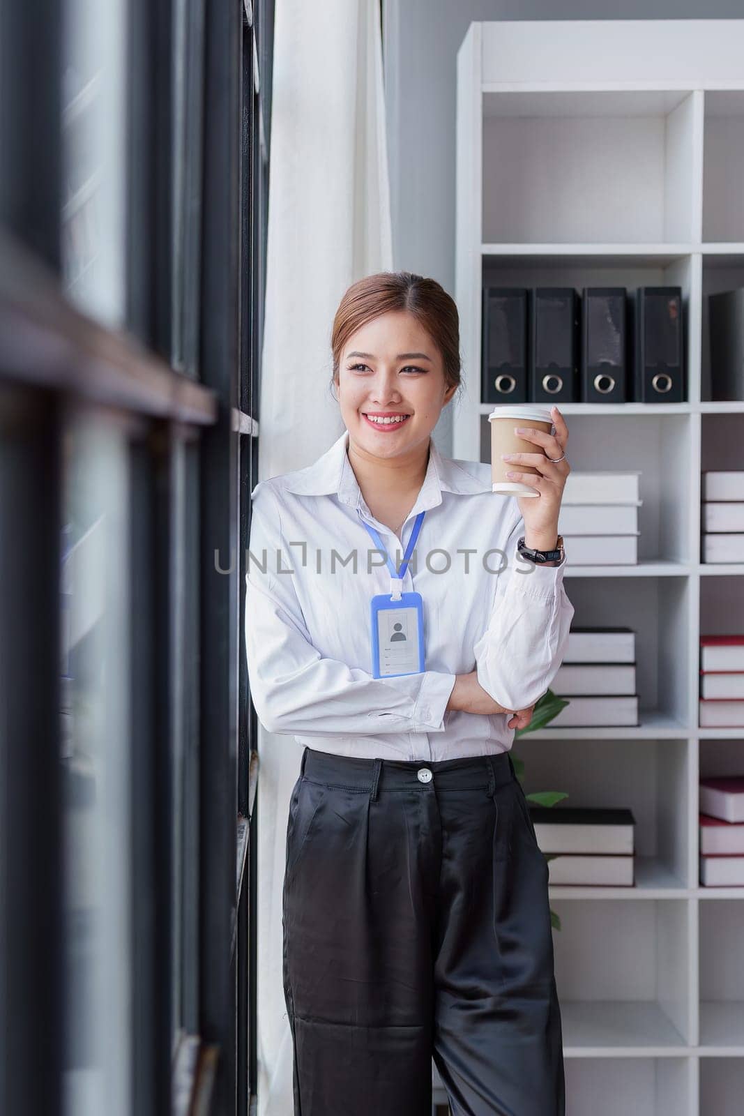 Confident Businesswoman with Laptop. Navigating the Path to Success and Happiness in the Corporate Environment