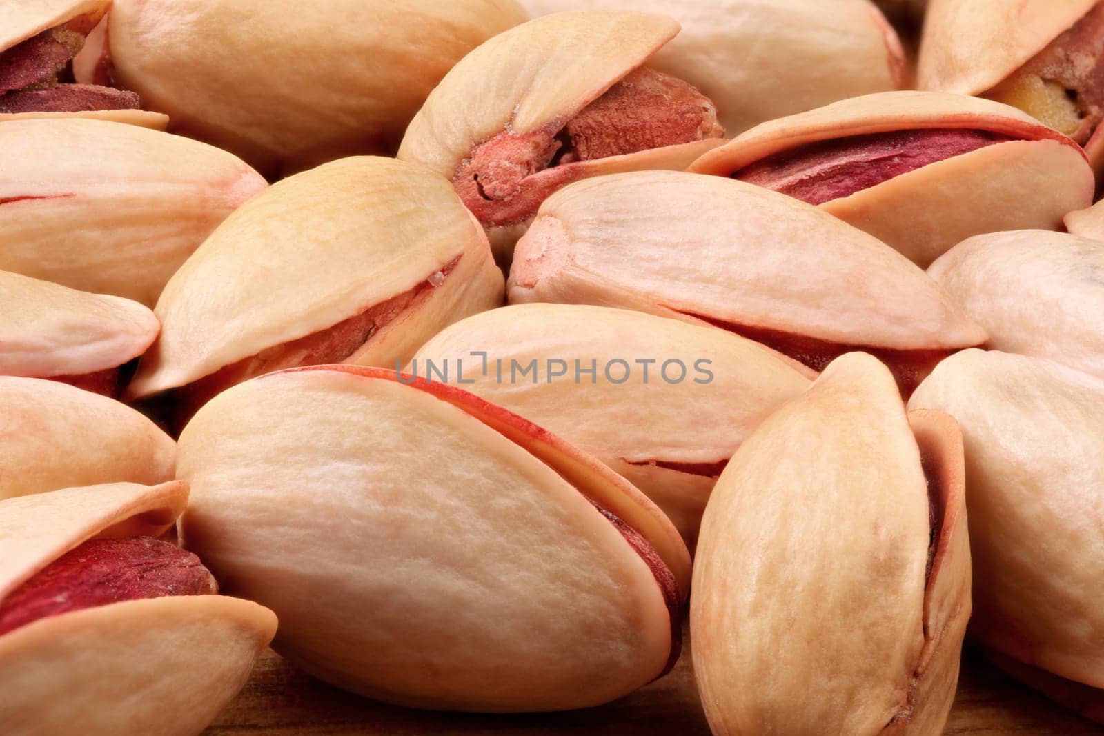 Detailed view on pile of roasted and salted Turkish red pistachios