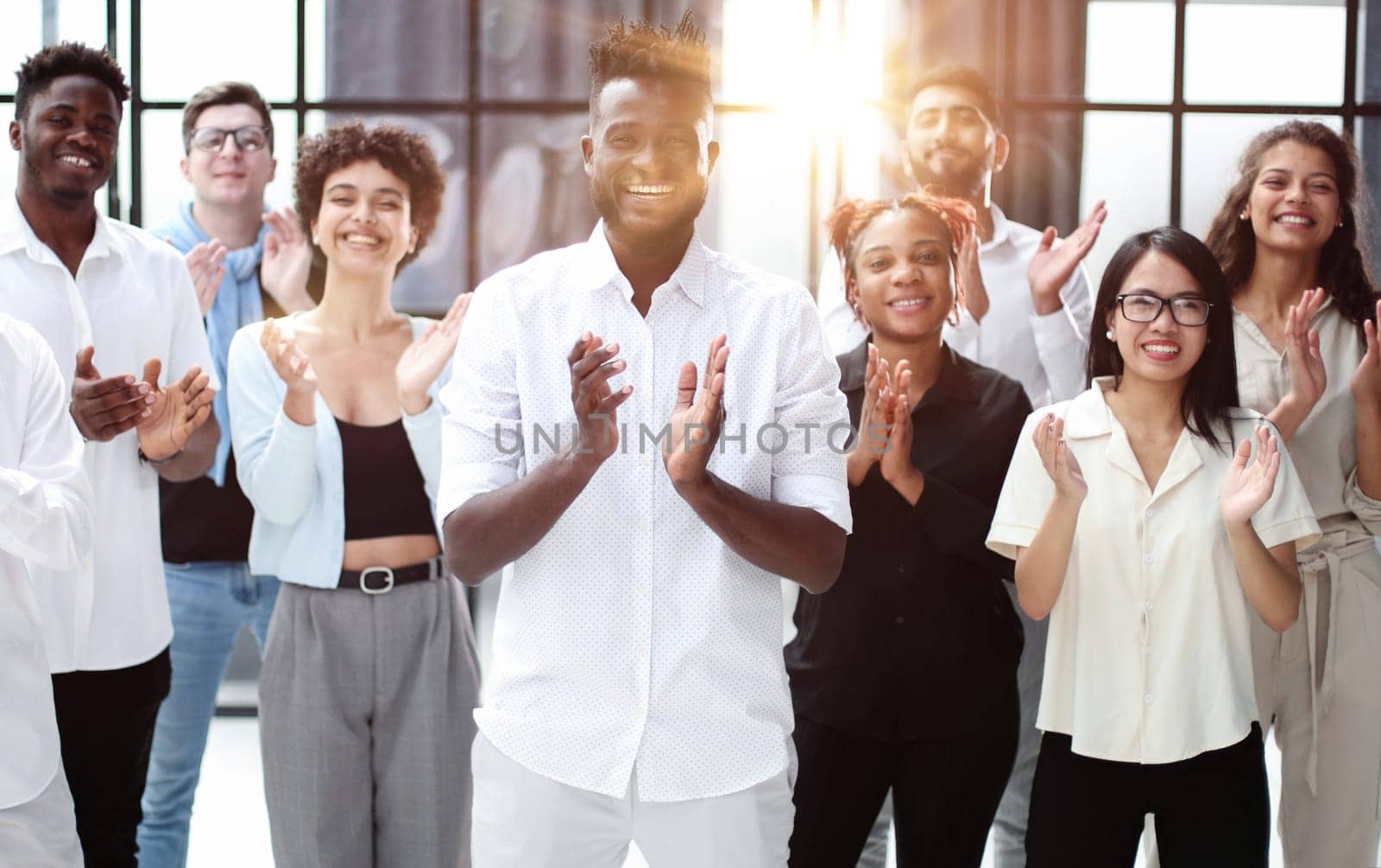 arge international group of happy people applauding together