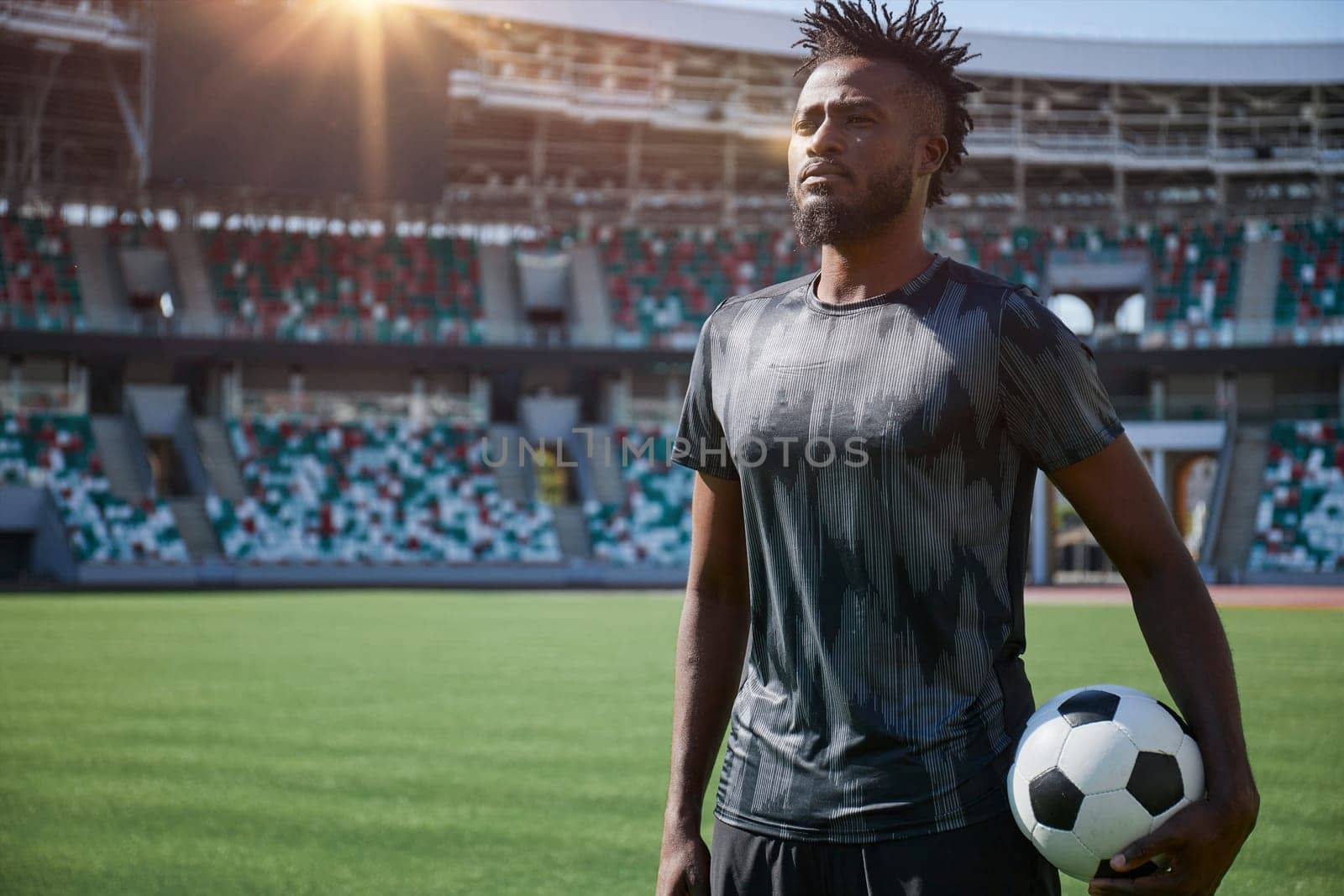 African American soccer player during match inside large stadium