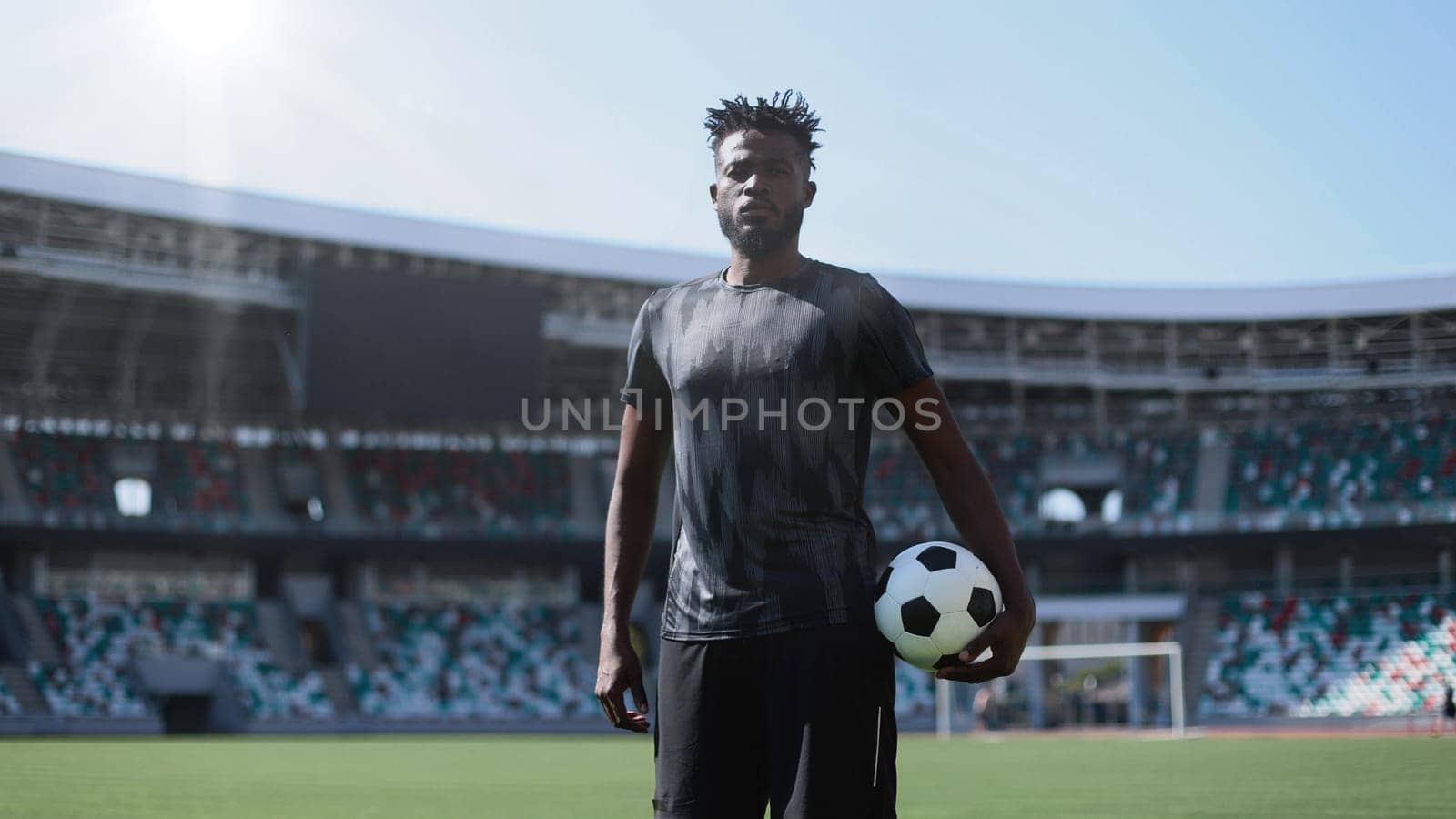 African American soccer player during match inside large stadium
