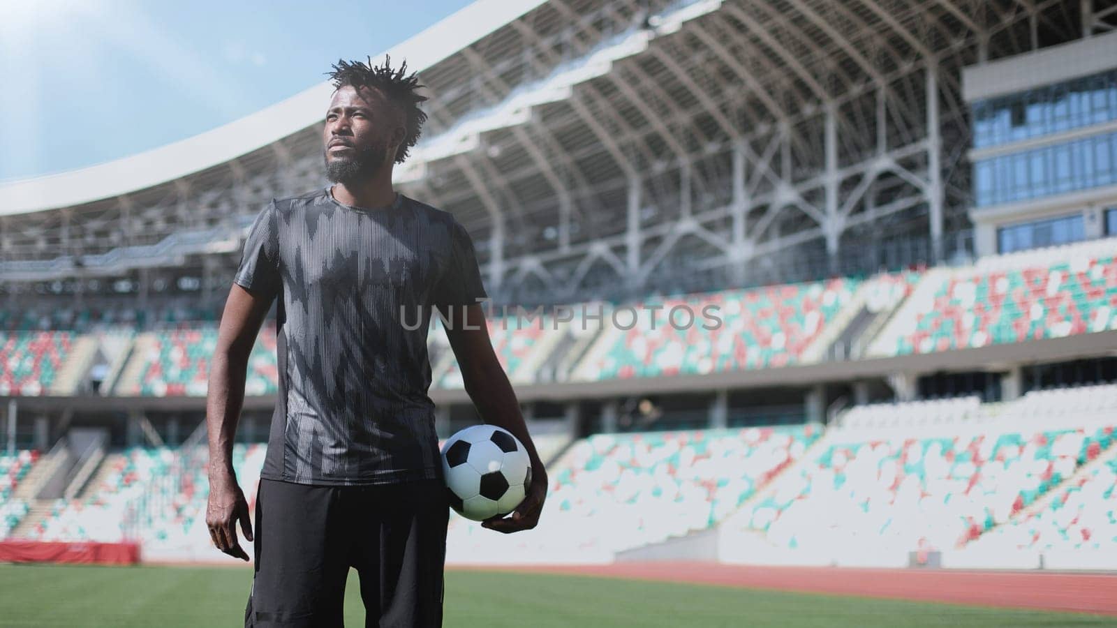 African American soccer player during match inside large stadium