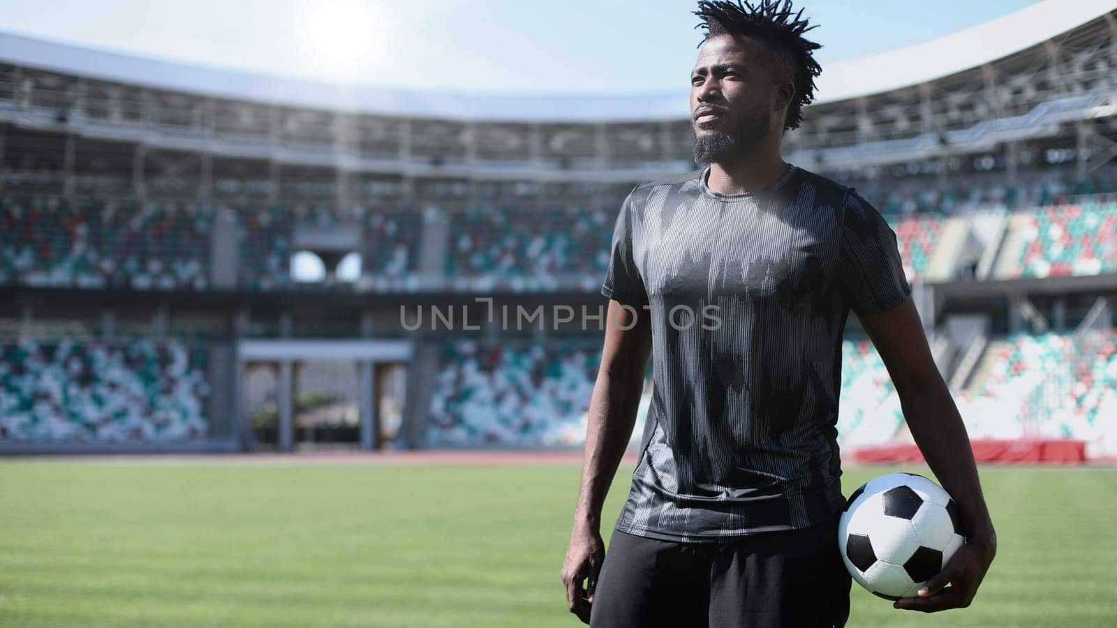 African American soccer player during match inside large stadium