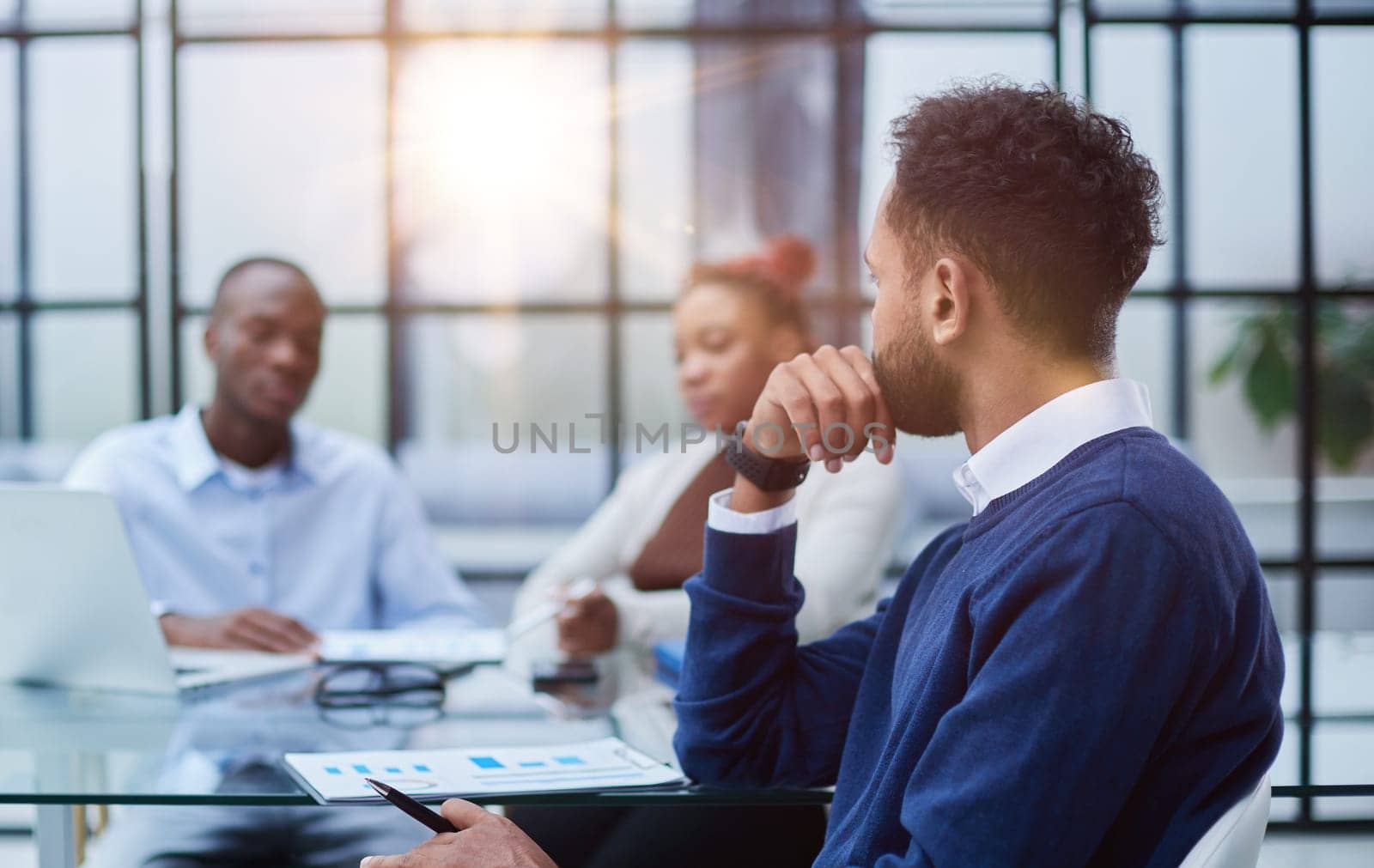 Portrait of African American businessman sitting at desk in an office