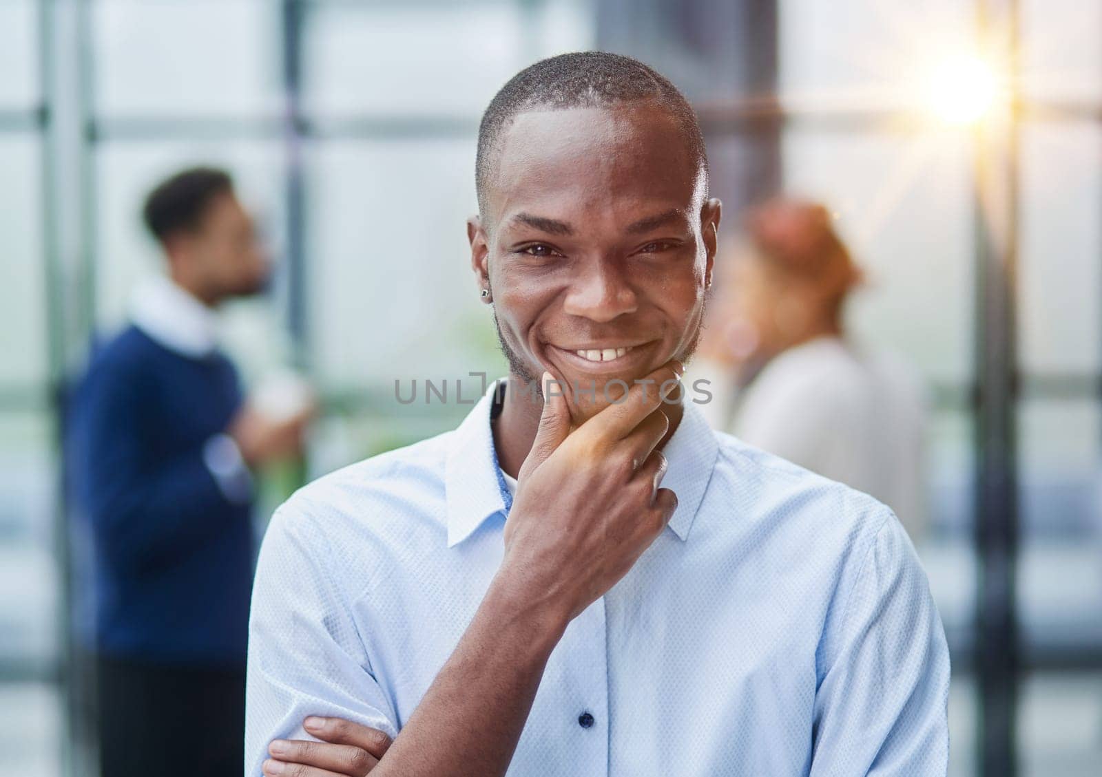 Portrait of a young African American businessman at his workplace waiting for inspiration while