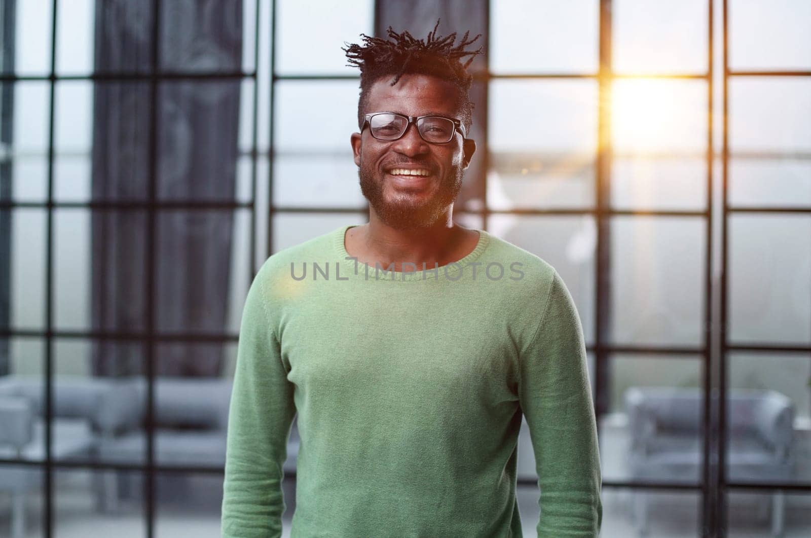 Mature cheerful african american executive businessman at workspace.