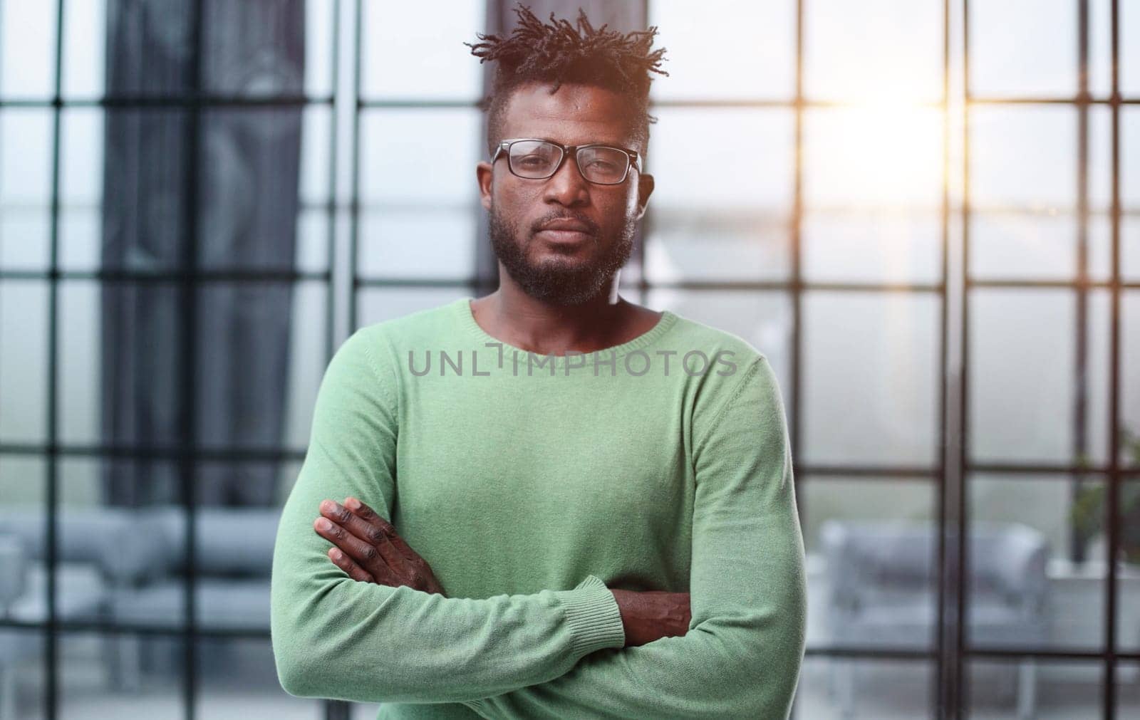 Mature cheerful african american executive businessman at workspace.