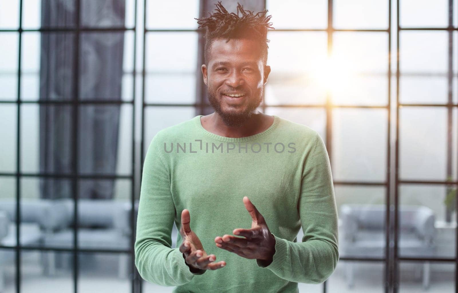 Portrait of a happy African American entrepreneur in office