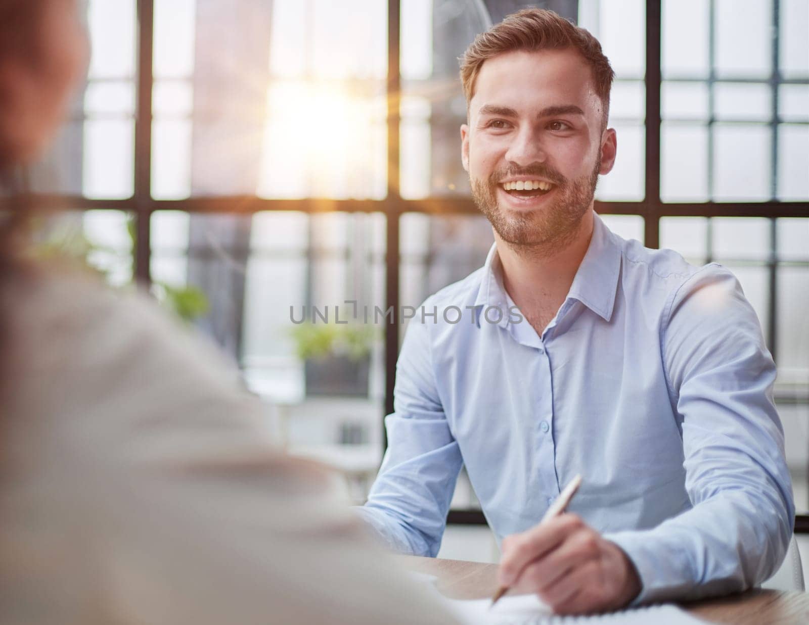 Handsome bearded man in a modern office